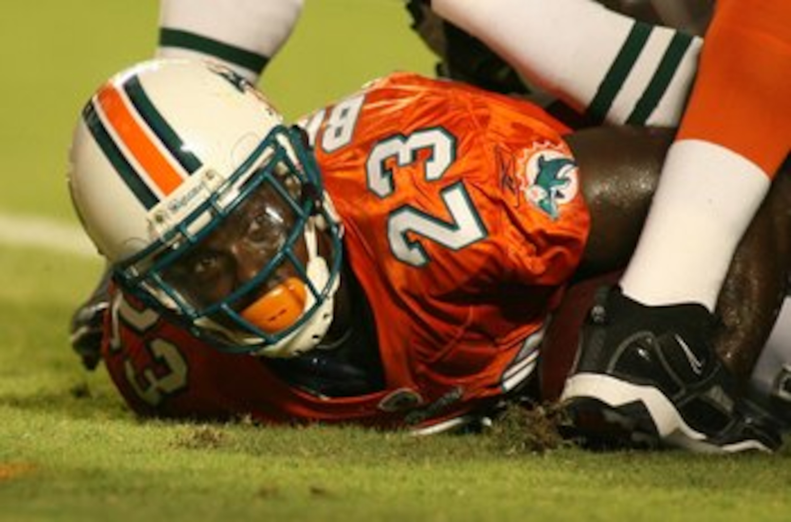 MIAMI - OCTOBER 12:  Running back Ronnie Brown #23 of the Miami Dolphins scores a touchdown against the New York Jets fans prior to their game at Land Shark Stadium on October 12, 2009 in Miami, Florida. Miami defeated New York 31-27.  (Photo by Marc Sero