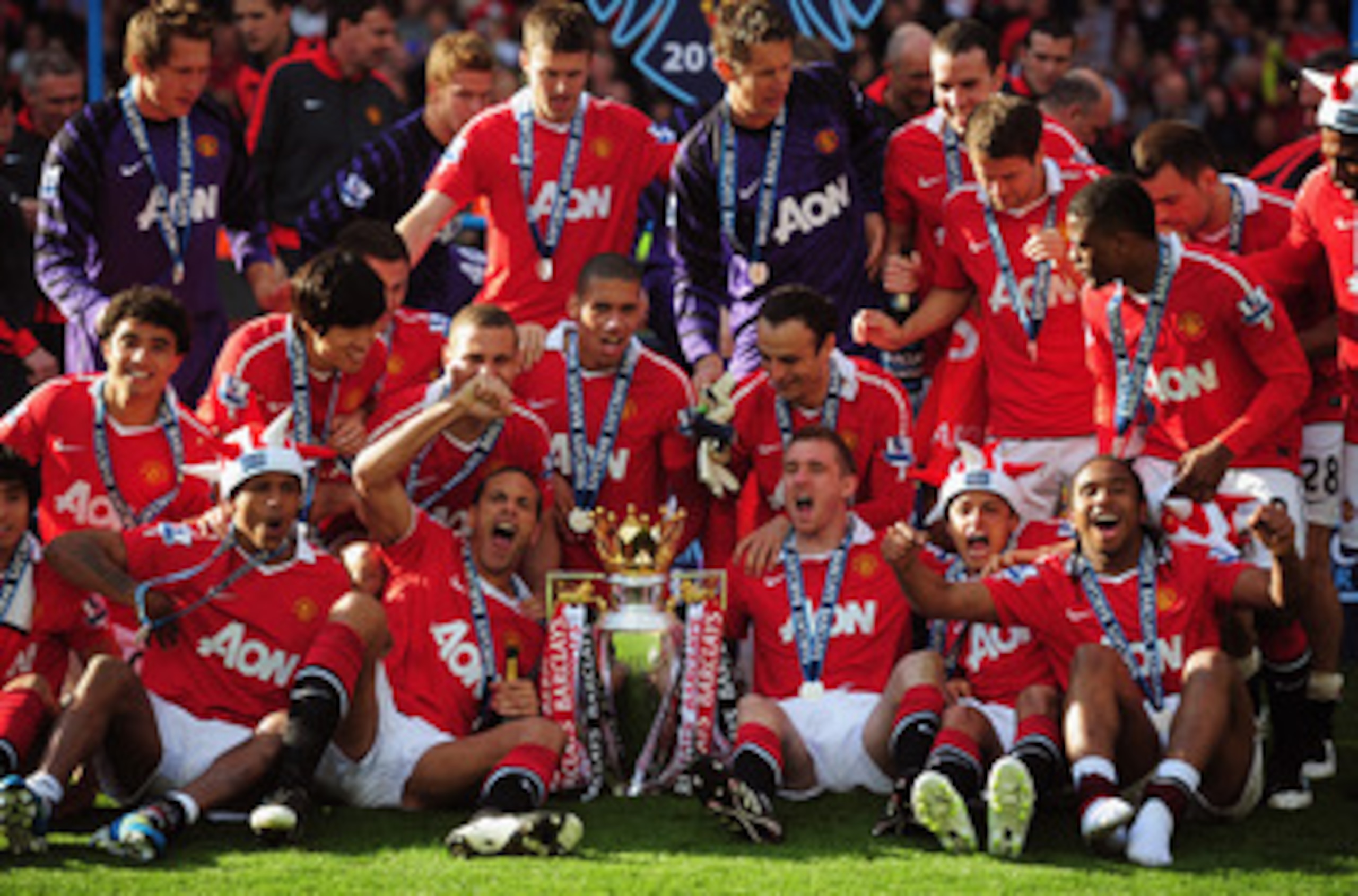 MANCHESTER, ENGLAND - MAY 22:  Manchester United celebrate with the Premier League trophy after the Barclays Premier League match between Manchester United and Blackpool at Old Trafford on May 22, 2011 in Manchester, England. Manchester United celebrate a