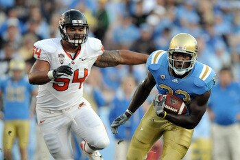 PASADENA, CA - NOVEMBER 06:  Derrick Coleman #33 of the UCLA Bruins runs from Stephen Paea #54 of the Oregon State Beavers at the Rose Bowl on November 6, 2010 in Pasadena, California.  (Photo by Harry How/Getty Images)