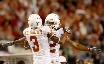 ARLINGTON, TX - DECEMBER 5:  Curtis Brown #3 and Earl Thomas #12 of the Texas Longhorns celebrate breaking up a pass against the Nebraska Cornhuskers in the third quarter at Cowboys Stadium on December 5, 2009 in Arlington, Texas.  (Photo by Ronald Martin