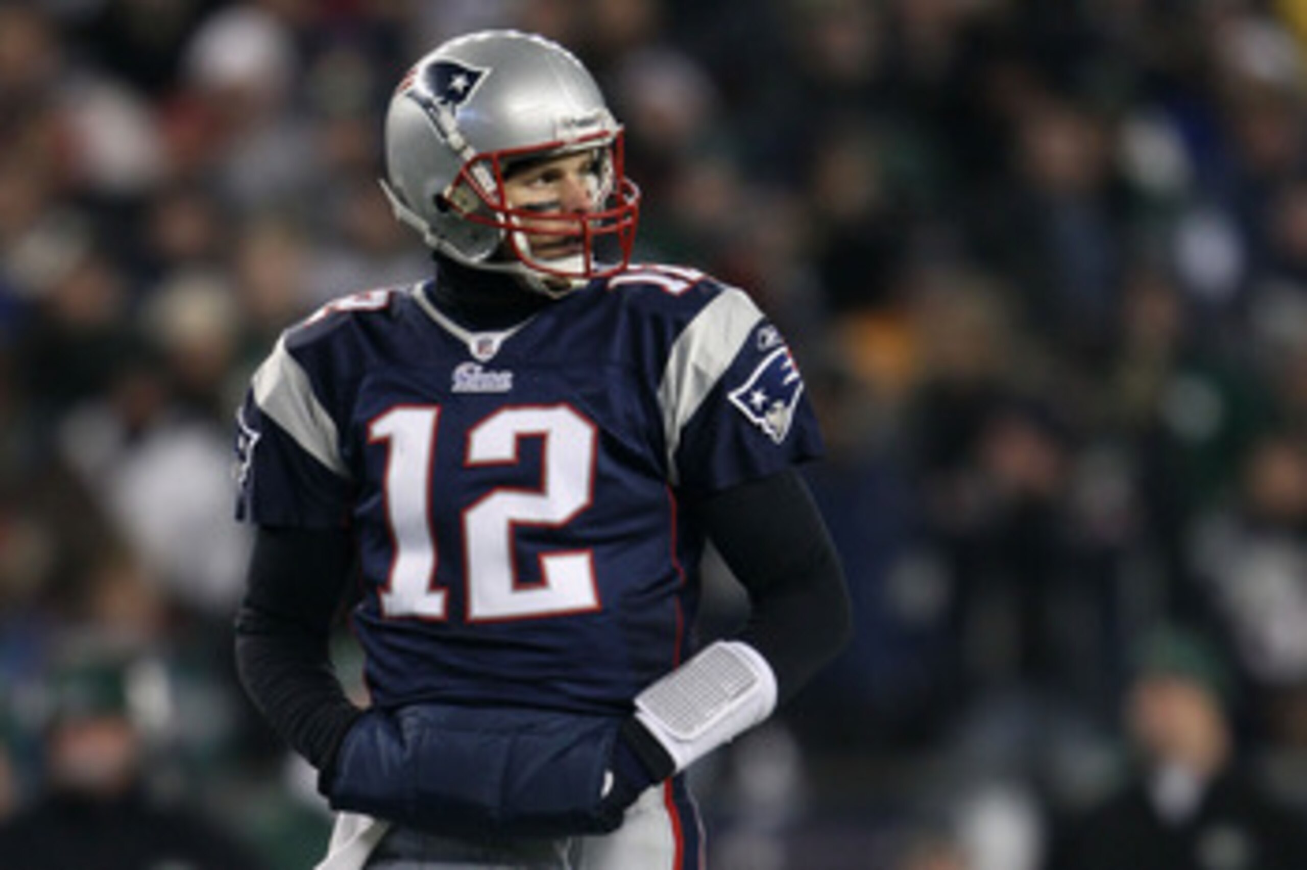 FOXBORO, MA - JANUARY 16:  Quarterback Tom Brady #12 of the New England Patriots stands on the field during their 2011 AFC divisional playoff game against the New York Jets at Gillette Stadium on January 16, 2011 in Foxboro, Massachusetts.  (Photo by Elsa