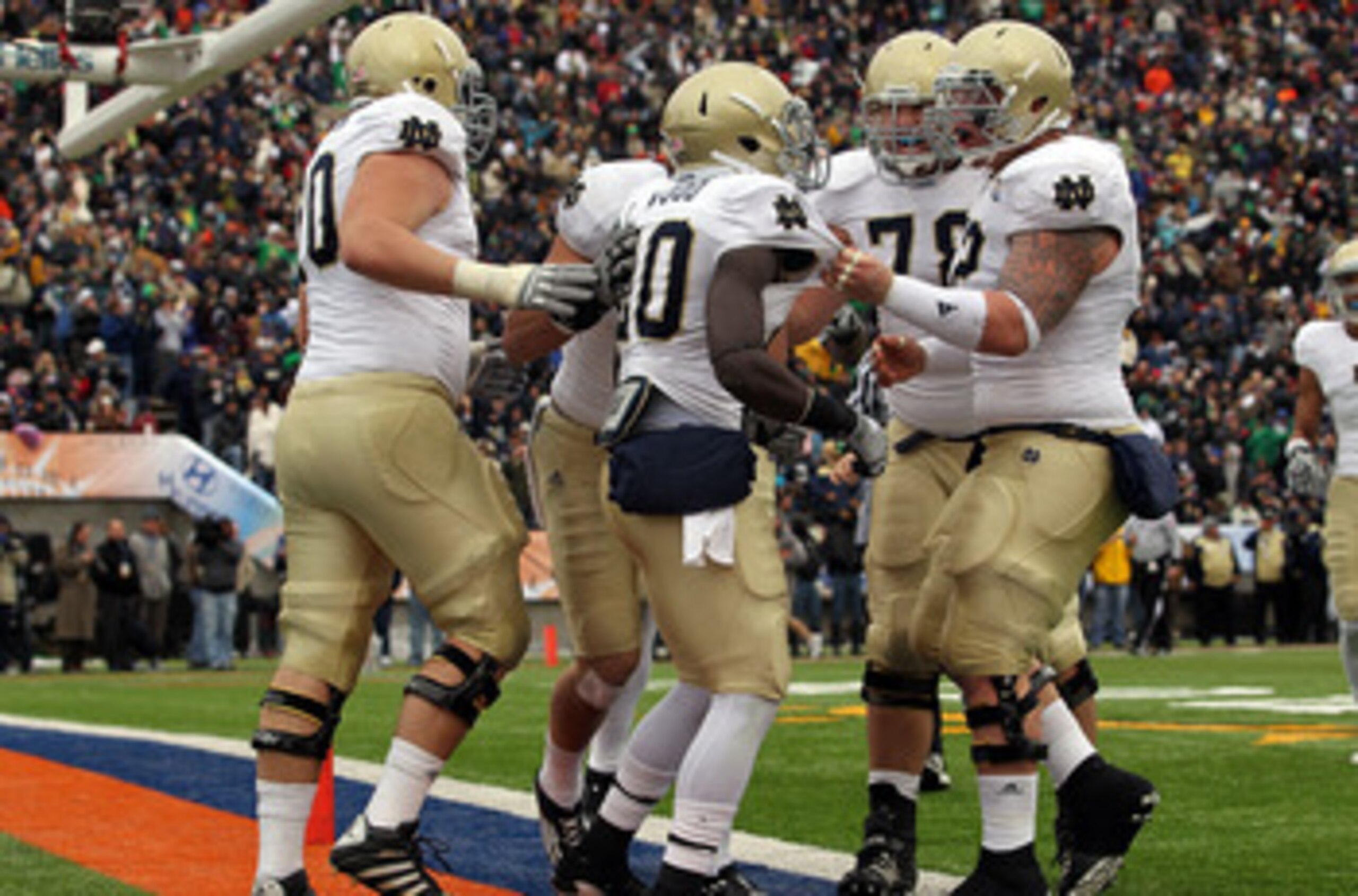 EL PASO, TX - DECEMBER 30:  Running back Cierre Wood #20 of the Notre Dame Fighting Irish celebrates a touchdown against the Miami Hurricanes during the Hyundai Sun Bowl at Sun Bowl on December 30, 2010 in El Paso, Texas.  (Photo by Ronald Martinez/Getty