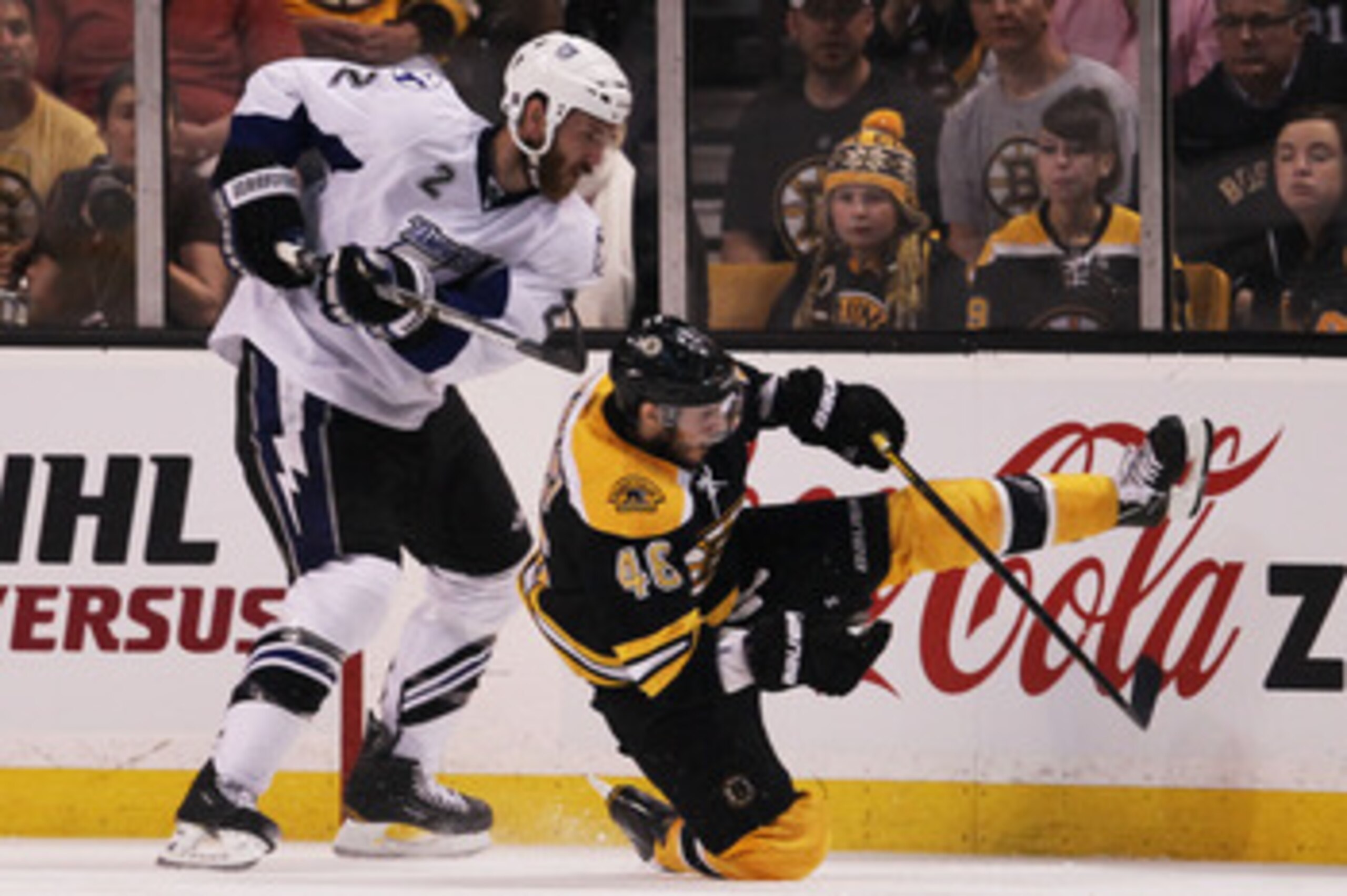 BOSTON, MA - MAY 27:  Eric Brewer #2 of the Tampa Bay Lightning knocks David Krejci #46 of the Boston Bruins to the ice in the second period of Game Seven of the Eastern Conference Finals during the 2011 NHL Stanley Cup Playoffs at TD Garden on May 27, 20