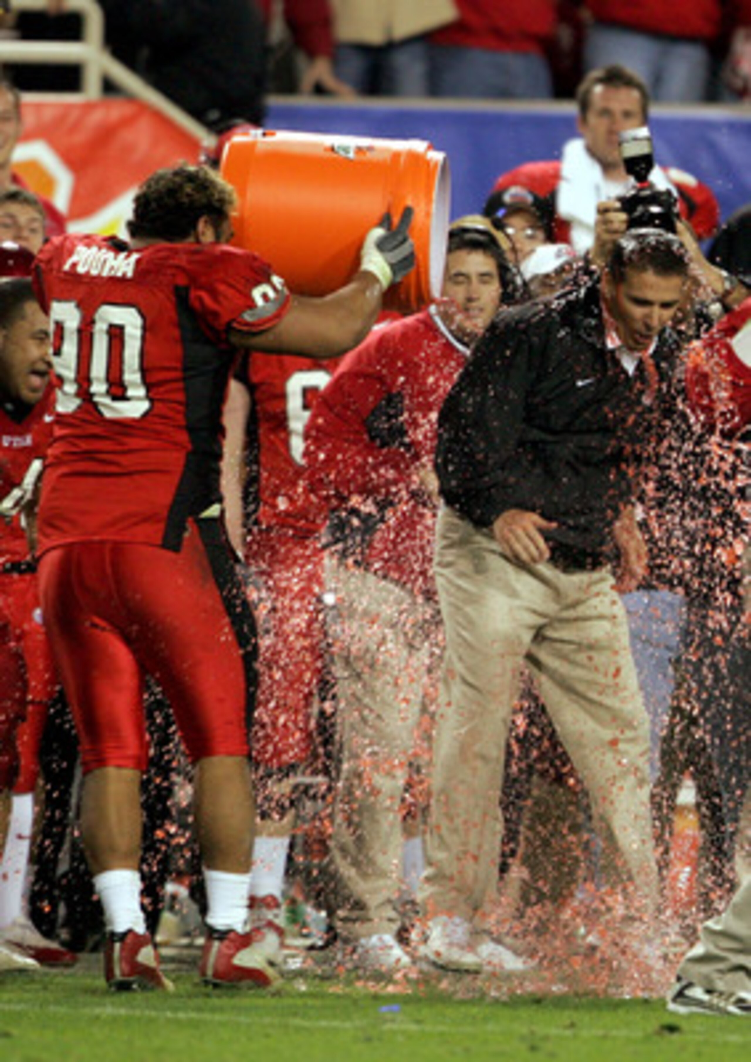 TEMPE, AZ - JANUARY 1:  Utah head coach Urban Meyer is doused with Gatorade after his team's 35-7 victory over Pittsburgh in the Tostito's Fiesta Bowl at the Sun Devil Stadium on January 1, 2005 in Tempe, Arizona. (Photo by Jeff Gross/Getty Images).