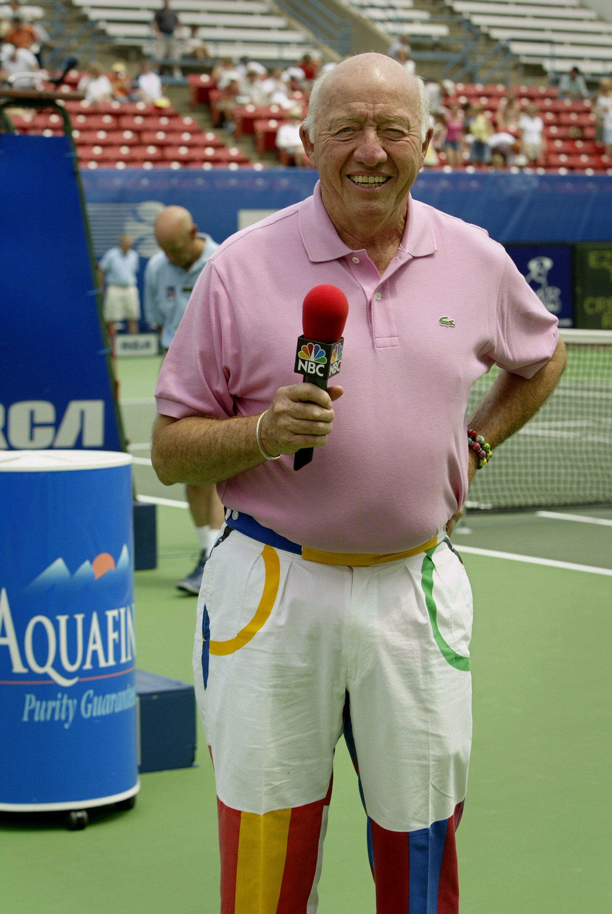 INDIANAPOLIS - JULY 26:  Bud Collins commentates for NBC as Andy Roddick of the USA takes on Sjeng Schalken of the Netherlands during the semifinals of the 2003 RCA Championships at the Indianapolis Tennis Center on July 26, 2003 in Indianapolis, Indiana.