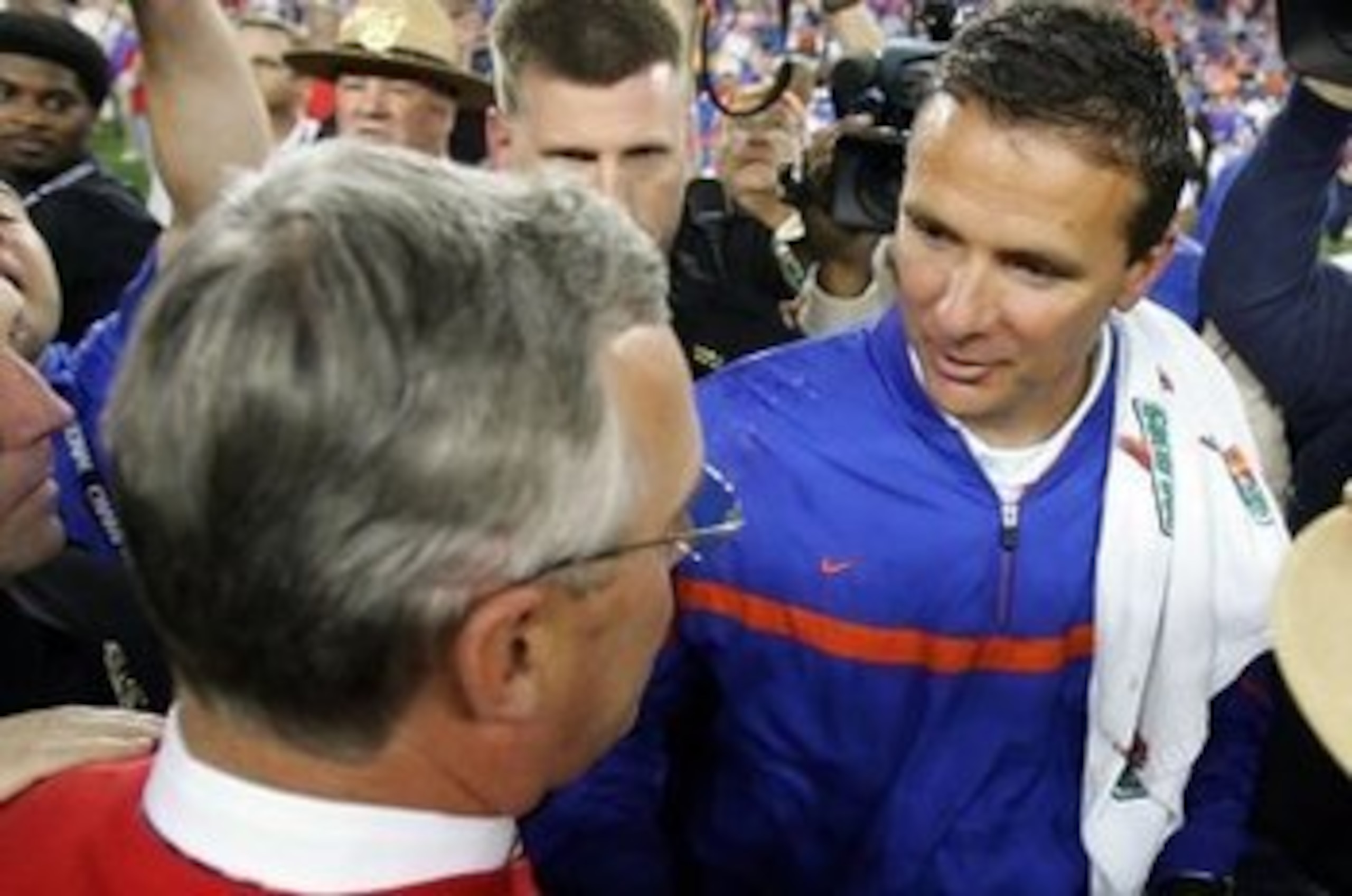 GLENDALE, AZ - JANUARY 08: (R-L) Head coach Urban Meyer of the Florida Gators shakes hands with head coach Jim Tressel of the Ohio State Buckeyes after the 2007 Tostitos BCS National Championship Game at the University of Phoenix Stadium on January 8, 20 GLENDALE, AZ - JANUARY 08: (R-L) Head coach Urban Meyer of the Florida Gators shakes hands with head coach Jim Tressel of the Ohio State Buckeyes after the 2007 Tostitos BCS National Championship Game at the University of Phoenix Stadium on January 8, 20