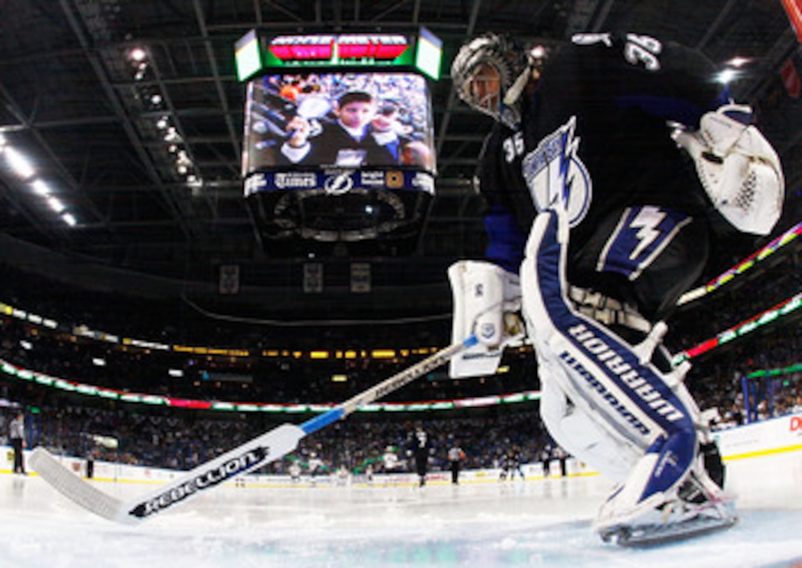 TAMPA, FL - MAY 25:  Dwayne Roloson #35 of the Tampa Bay Lightning defends against the Boston Bruins in Game Six of the Eastern Conference Finals during the 2011 NHL Stanley Cup Playoffs at St Pete Times Forum on May 25, 2011 in Tampa, Florida.  (Photo by