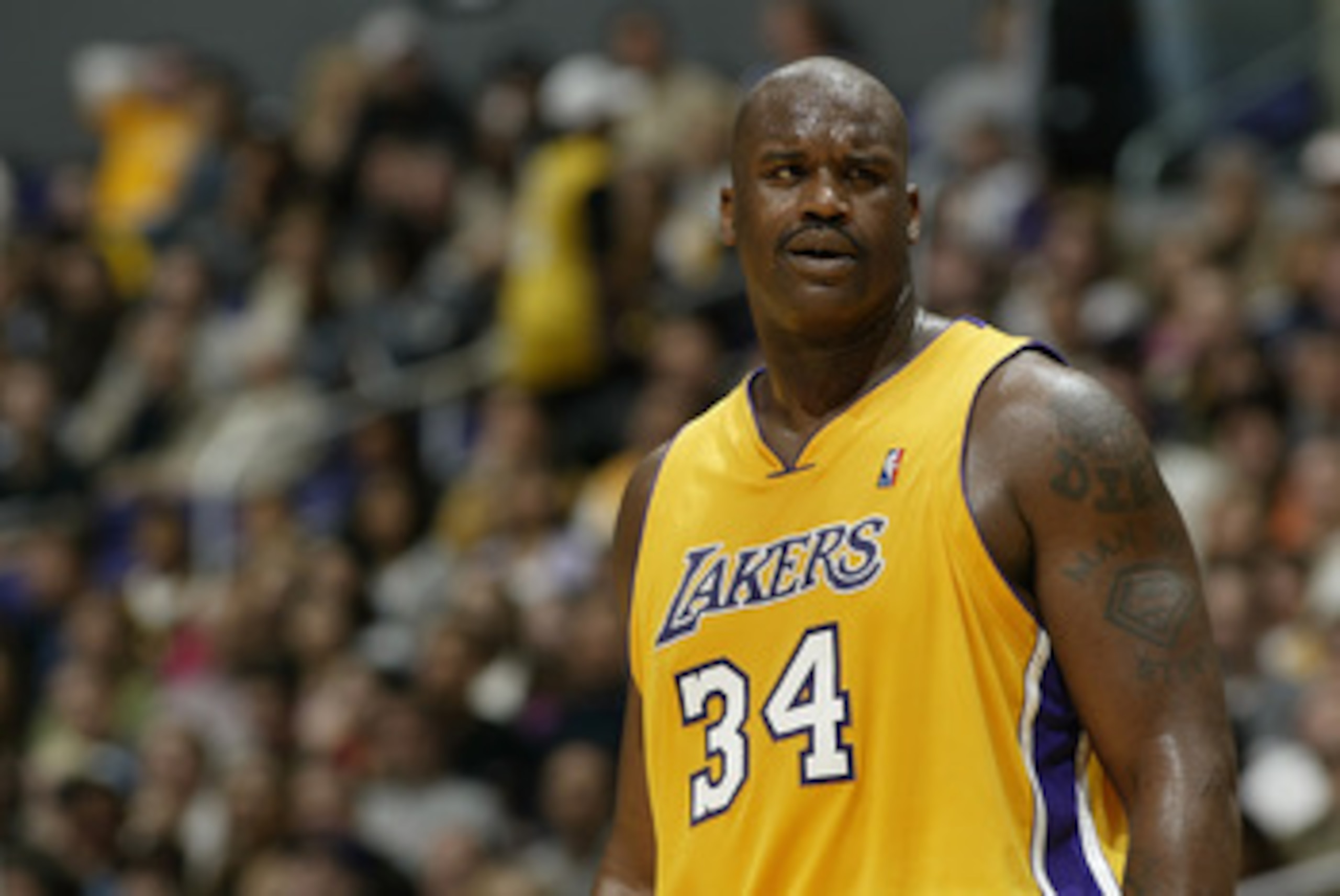 LOS ANGELES - APRIL 9: Shaquille O'Neal #34 of the Los Angeles Lakers stands on the court during the game against the Memphis Grizzlies at Staples Center on April 9, 2004 in Los Angeles, California. The Lakers won 103-95. NOTE TO USER: User expressly a LOS ANGELES - APRIL 9: Shaquille O'Neal #34 of the Los Angeles Lakers stands on the court during the game against the Memphis Grizzlies at Staples Center on April 9, 2004 in Los Angeles, California. The Lakers won 103-95. NOTE TO USER: User expressly a