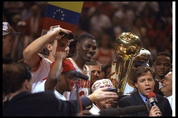 14 Jun 1995:  Center Hakeen Olajuwon of the Houston Rockets celebrates after a Finals game against the Orlando Magic at The Summit in Houston, Texas.  The Rockets won the game, 113-101. Mandatory Credit: Allsport  /Allsport Mandatory Credit: Allsport  /Al