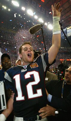 HOUSTON, TX - FEBRUARY 1:  MVP Tom Brady of the New England Patriots celebrates after defeating the Carolina Panthers 32-29 in Super Bowl XXXVIII at Reliant Stadium on February 1, 2004 in Houston, Texas. (Photo by Andy Lyons/Getty Images)