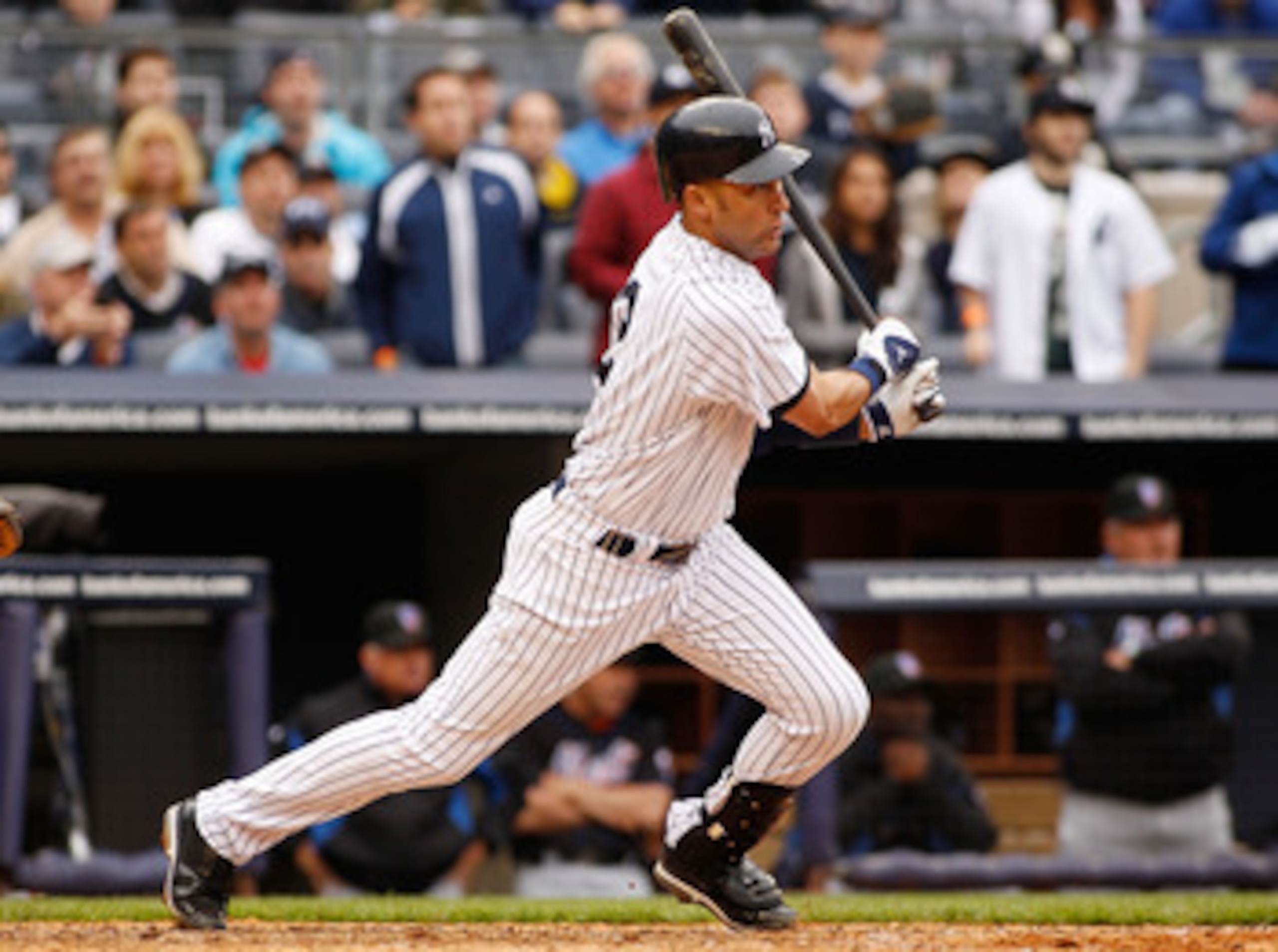 NEW YORK - MAY 22:  Derek Jeter #2 of the New York Yankees hits a two run single in the seventh inning to tie the game at three against the New York Mets on May 22, 2011 at Yankee Stadium in the Bronx borough of New York City. Yankees defeat the Mets 9-3.
