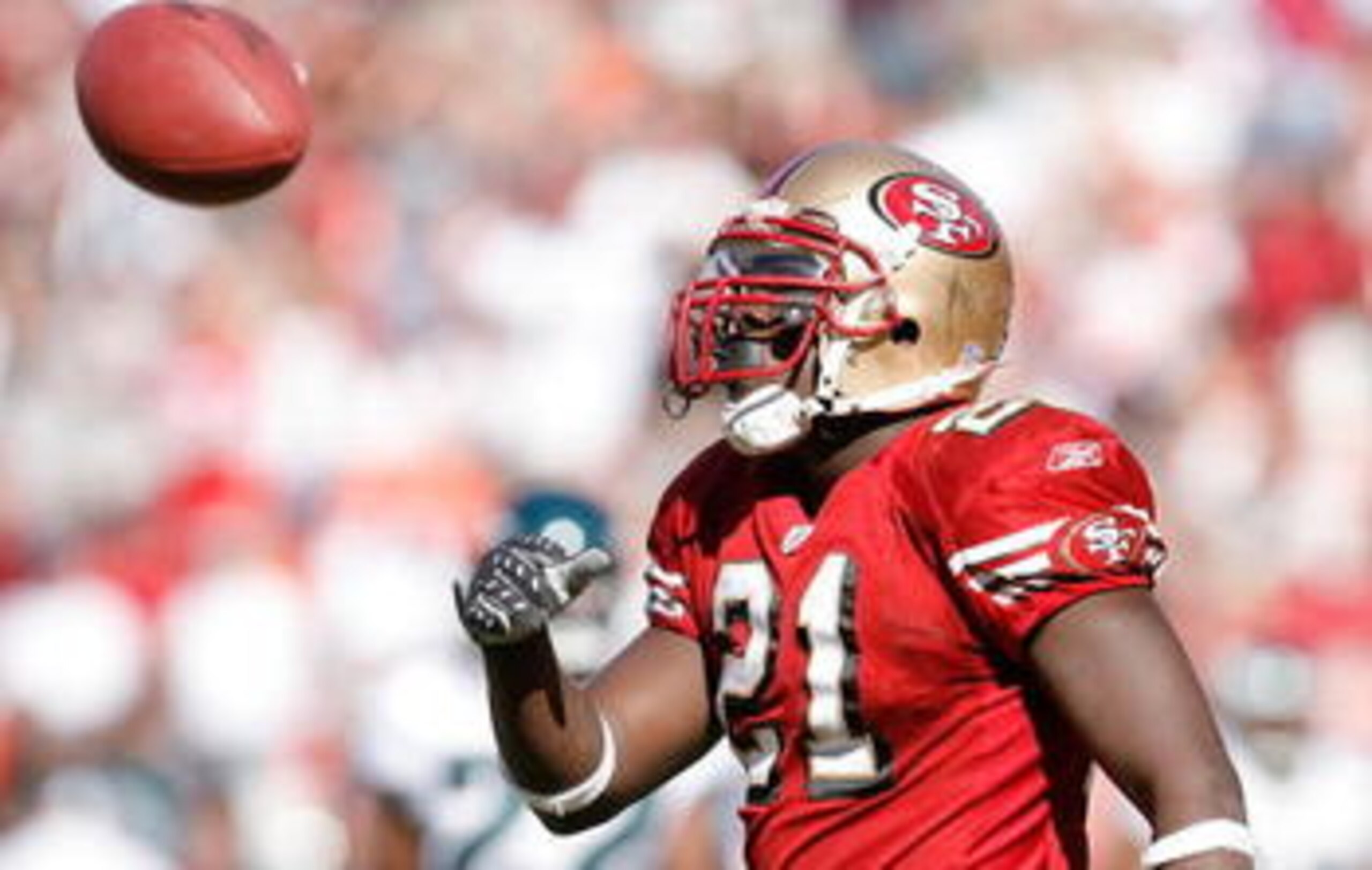 SAN FRANCISCO - NOVEMBER 12:  Frank Gore #21 of the San Francisco 49ers takes the field during player introductions against the Chicago Bears at Candlestick Park on November 12, 2009 in San Francisco, California.  (Photo by Jed Jacobsohn/Getty Images)