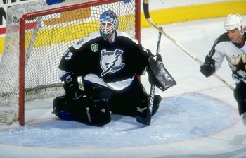 10 Dec 1997:  Goaltender Daren Puppa of the Tampa Bay Lightning in action against the Dallas Stars during a game at the Reunion Arena in Dallas, Texas.  The Stars defeated the Lightning 3-0. Mandatory Credit: Stephen Dunn  /Allsport