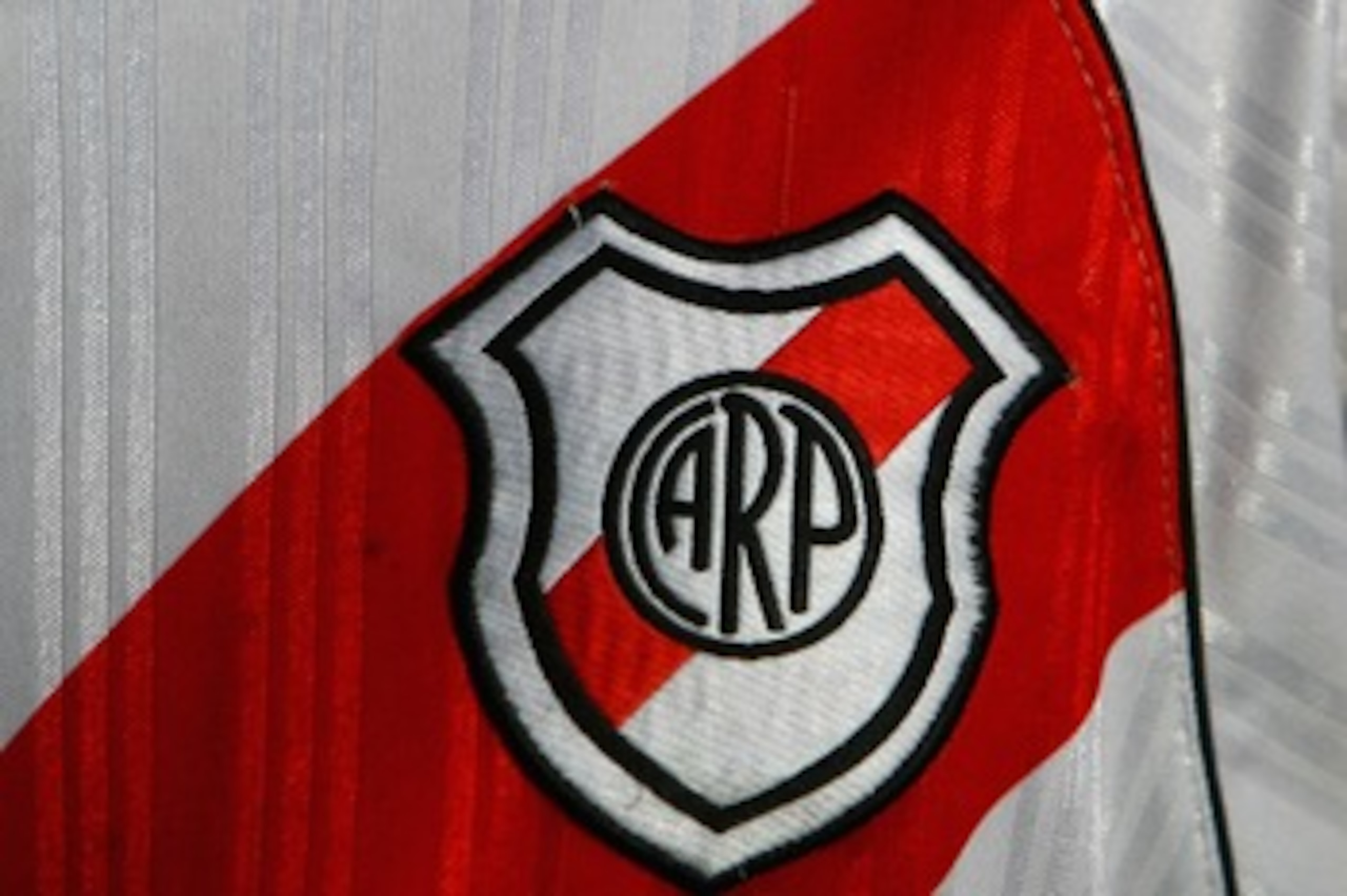 BUENOS AIRES, ARGENTINA - FEBRUARY 10:  The River Plate badge is seen on a supporters shirt before the Primera Division closing season match between River Plate and Gimnasia de Jujuy at the Estadio Monumental on February 10, 2008 in Buenos Aires, Argentin