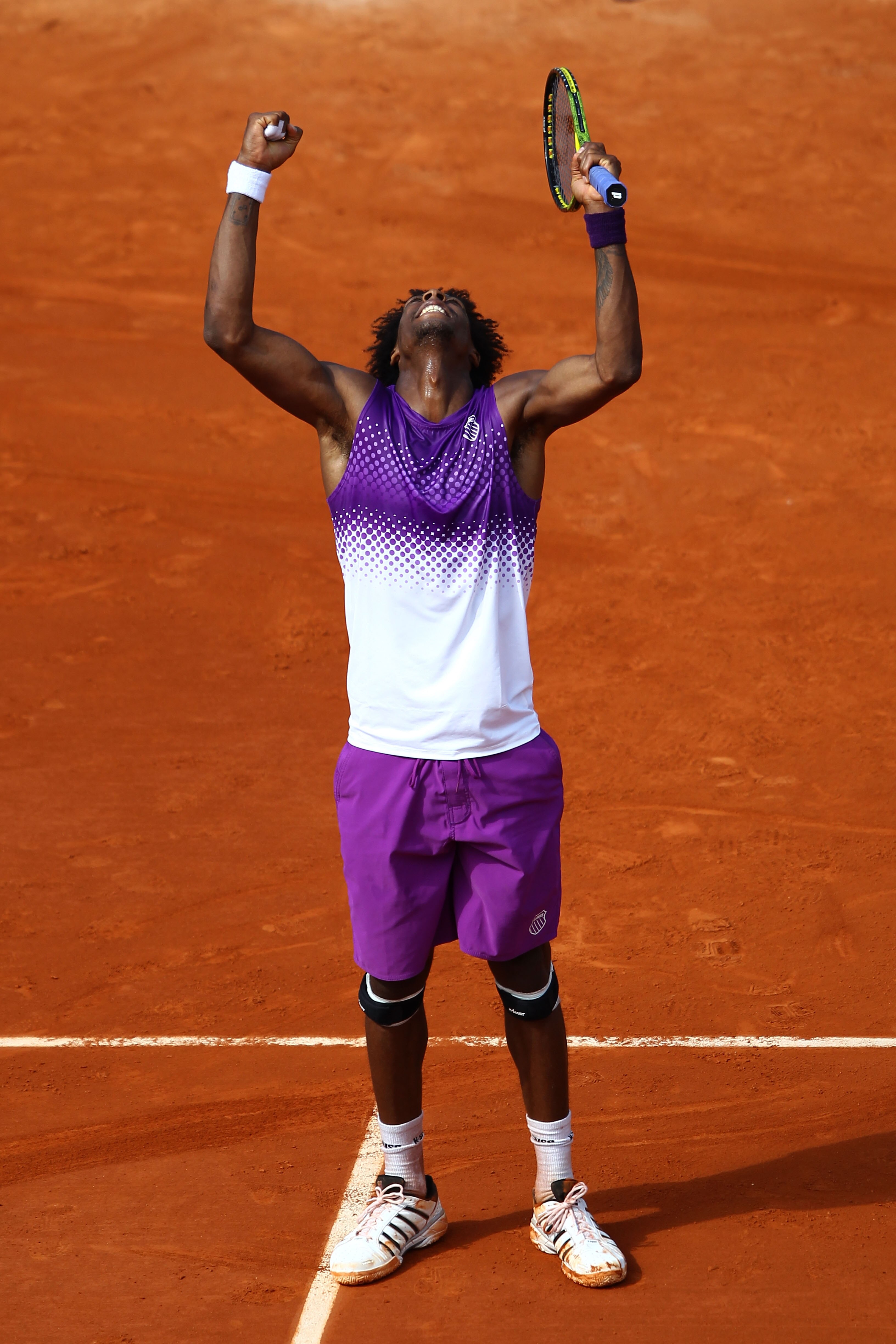 PARIS, FRANCE - MAY 30:  Gael Monfils of France celebrates matchpoint during the men's singles round four match between David Ferrer of Spain and Gael Monfils of France on day nine of the French Open at Roland Garros on May 30, 2011 in Paris, France.  (Ph