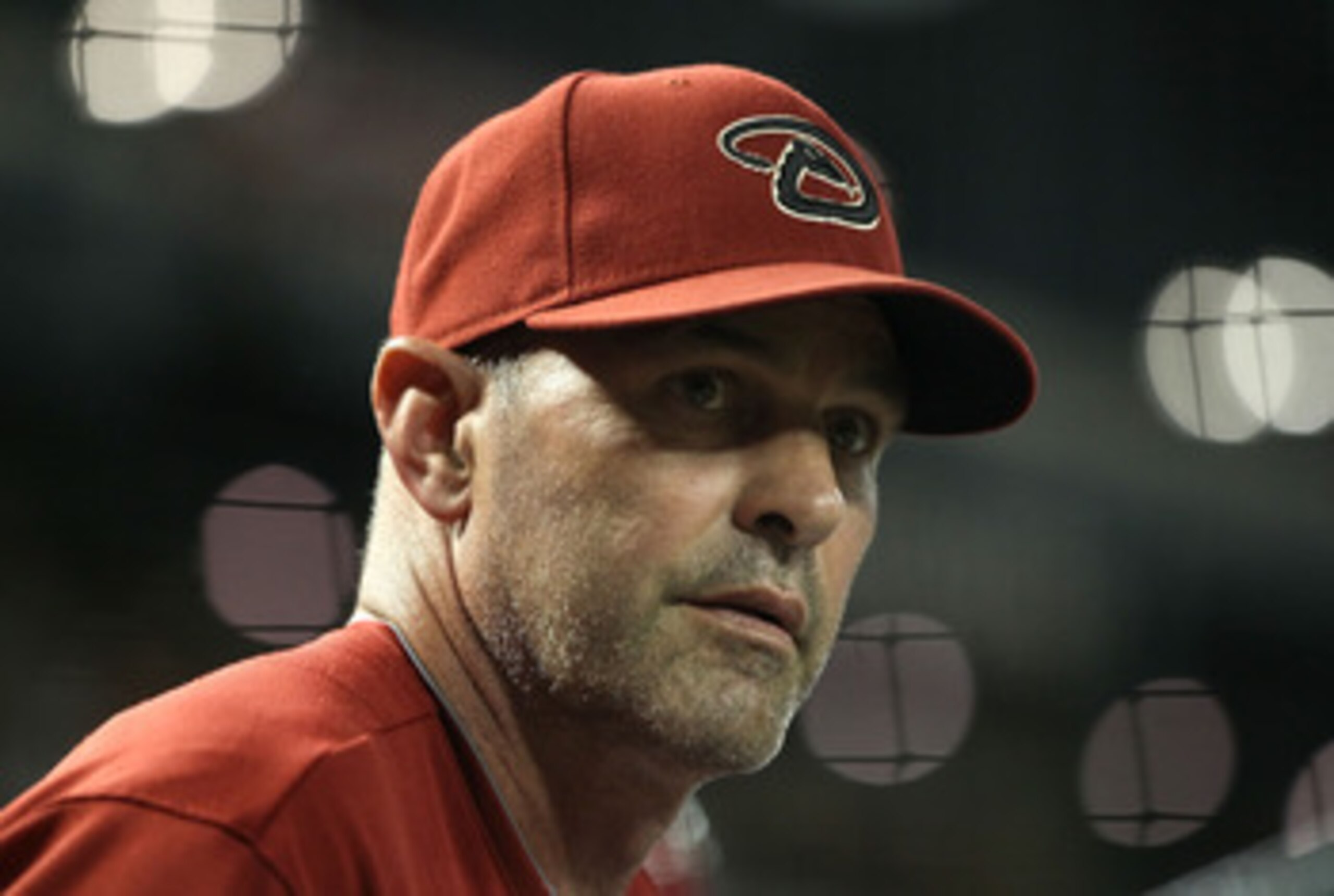 PHOENIX, AZ - MAY 18:  Manager Kirk Gibson of the Arizona Diamondbacks watches from the dugout during the Major League Baseball game against the Atlanta Braves at Chase Field on May 18, 2011 in Phoenix, Arizona. The Diamondbacks defeated the Braves 5-4 in