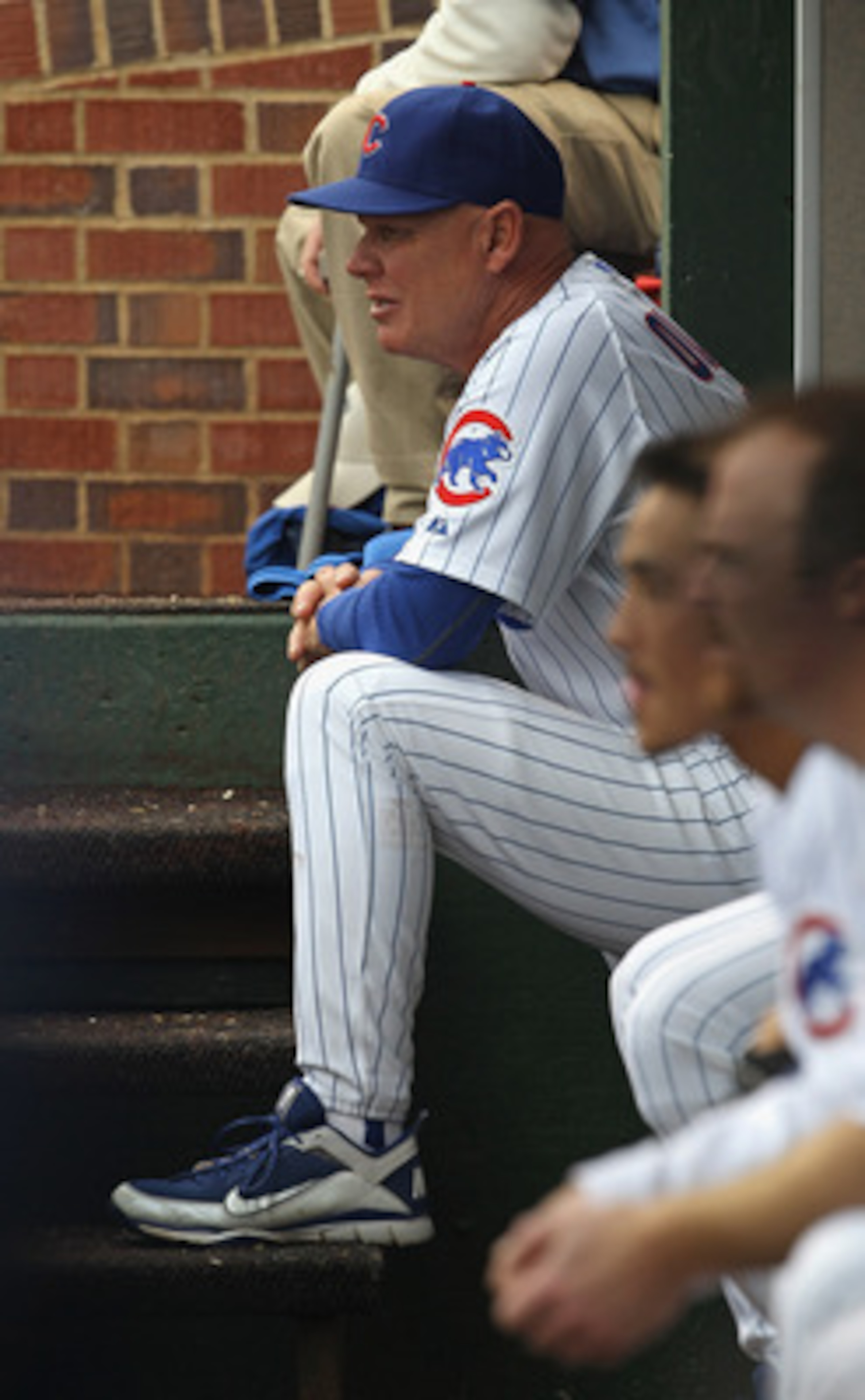 CHICAGO, IL - MAY 29: Manager Mike Quade #8 of the Chicago Cubs watches from the dugout as his team takes on the Pittsburgh Pirates at Wrigley Field on May 29, 2011 in Chicago, Illinois. The Cubs defeated the Pirates 3-2. (Photo by Jonathan Daniel/Getty I