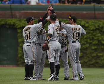 CHICAGO, IL - MAY 27: (L-R) Jose Tabata #31, Andrew McCutchen #22, Ronny Cedeno #5, Xavier Paul #38 and Neil Walker #18 of the Pittsburgh Pirates celebrate a win over the Chicago Cubs at Wrigley Field on May 27, 2011 in Chicago, Illinois. The Pirates defe CHICAGO, IL - MAY 27: (L-R) Jose Tabata #31, Andrew McCutchen #22, Ronny Cedeno #5, Xavier Paul #38 and Neil Walker #18 of the Pittsburgh Pirates celebrate a win over the Chicago Cubs at Wrigley Field on May 27, 2011 in Chicago, Illinois. The Pirates defe