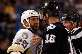 TAMPA, FL - APRIL 25: Maxime Talbot #25 of the Pittsburgh Penguins has a disagreement with Teddy Purcell #16 of the Tampa Bay Lightning in Game Six of the Eastern Conference Quarterfinals during the 2011 NHL Stanley Cup Playoffs at the St. Pete Times Foru