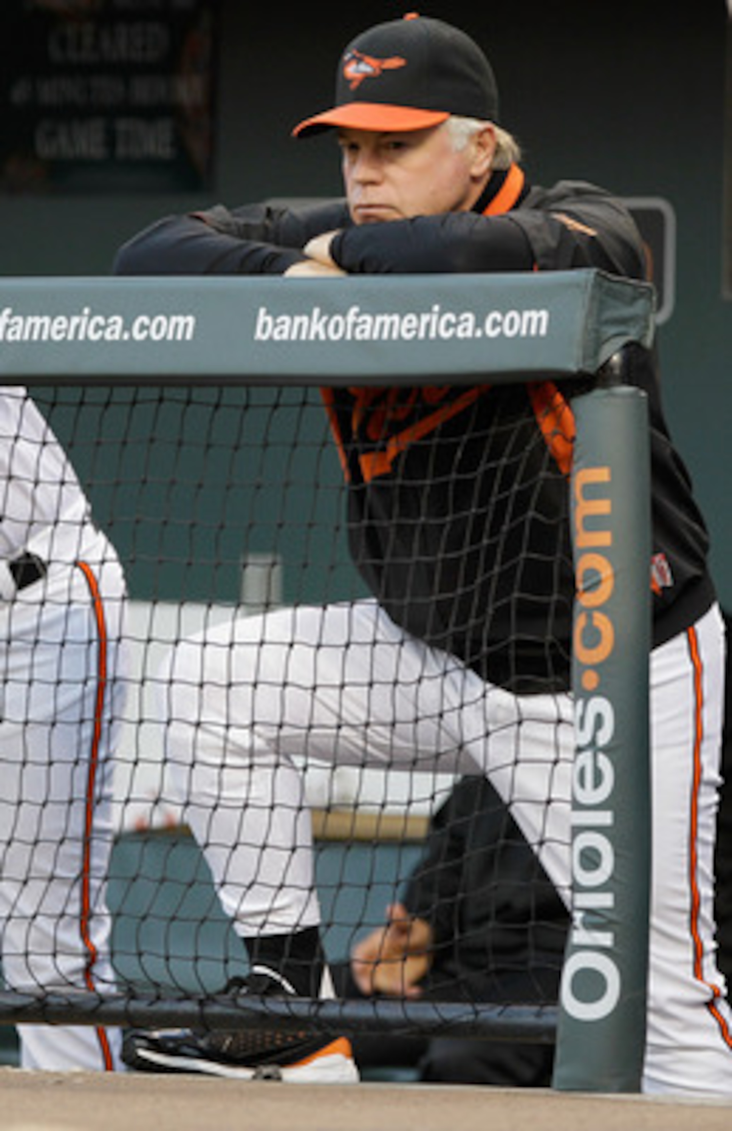 BALTIMORE, MD - MAY 12: Manager Buck Showalter #26 of the Baltimore Orioles in the dugout against the Seattle Mariners at Oriole Park at Camden Yards on May 12, 2011 in Baltimore, Maryland.  (Photo by Rob Carr/Getty Images)