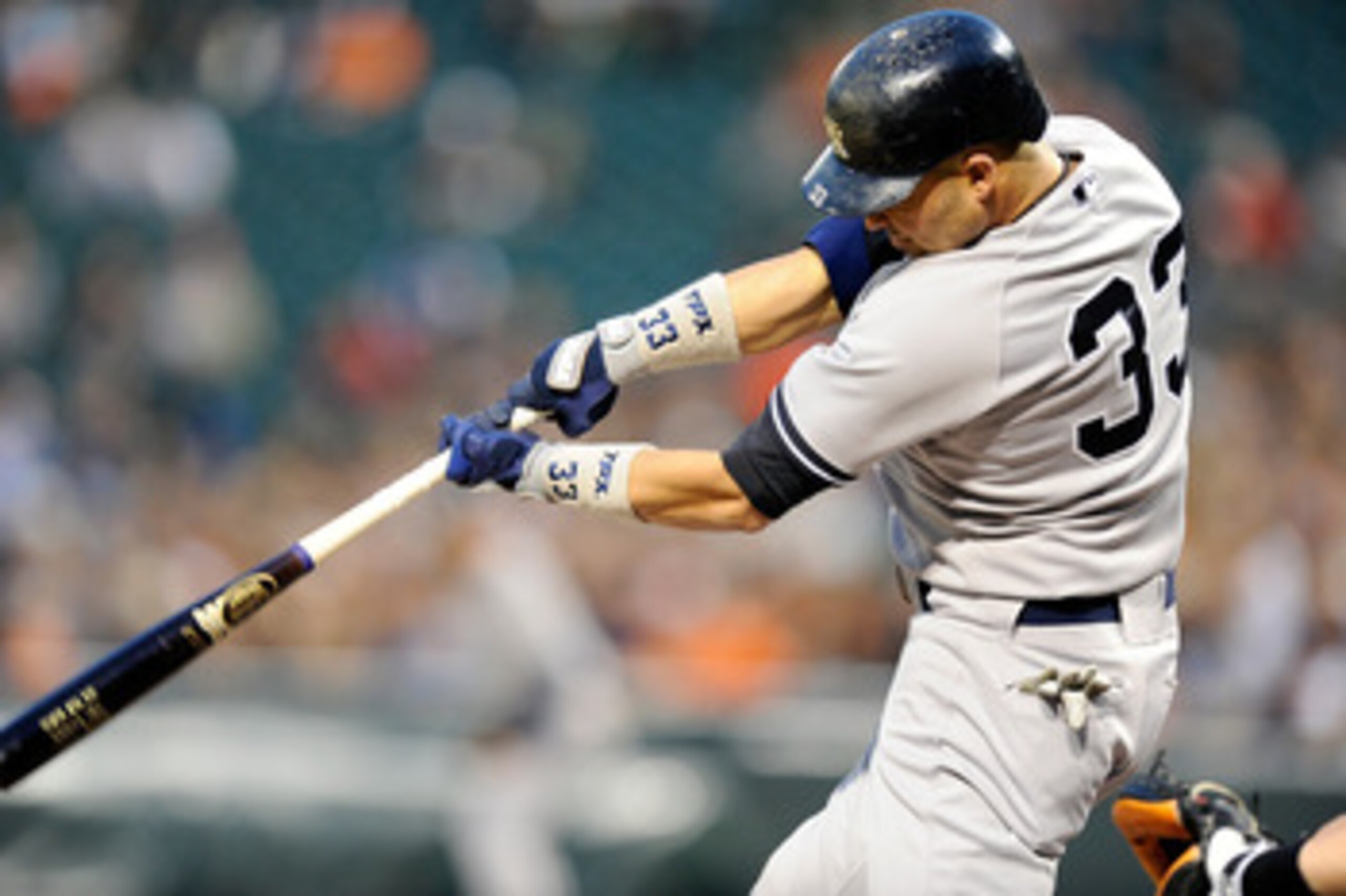 BALTIMORE, MD - MAY 19:  Nick Swisher #33 of the New York Yankees hits a double in the first inning against the Baltimore Orioles at Oriole Park at Camden Yards on May 19, 2011 in Baltimore, Maryland.  (Photo by Greg Fiume/Getty Images)
