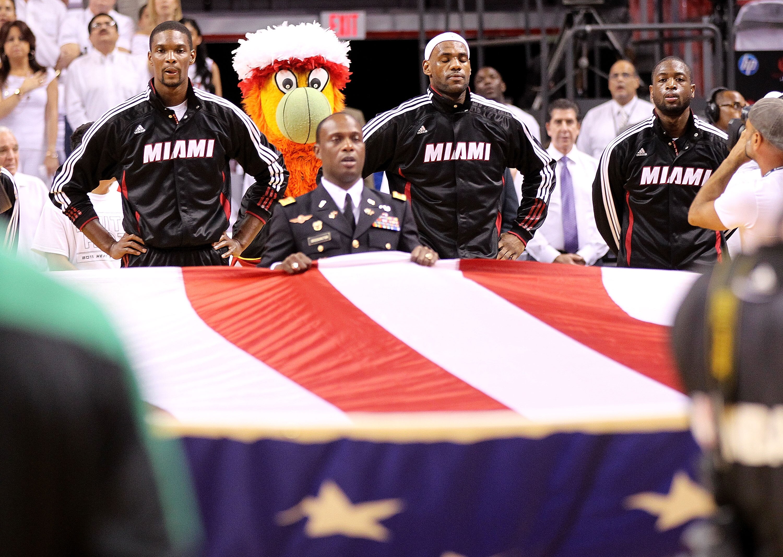 MIAMI, FL - MAY 03: Chris Bosh #1, LeBron James #6, and Dwyane Wade #3 of the Miami Heat look on during Game Two of the Eastern Conference Semifinals of the 2011 NBA Playoffs against the Boston Celtics at American Airlines Arena on May 3, 2011 in Miami, F