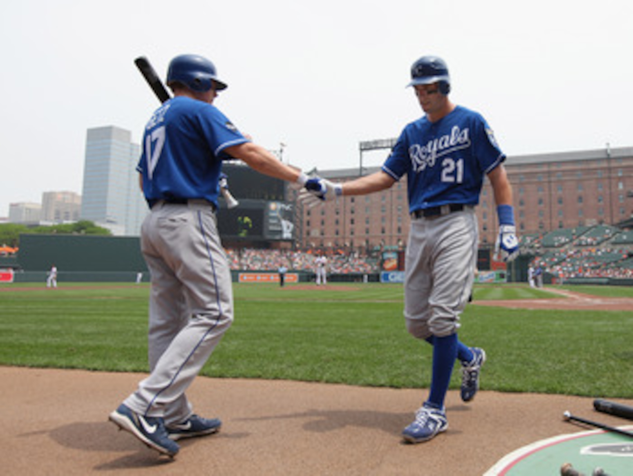 BALTIMORE, MD - MAY 26: Jeff Francoeur #21 of the Kansas City Royals is congratulated teammate Chris Getz #17 after scoring against the Baltimore Orioles during the second inning at Oriole Park at Camden Yards on May 26, 2011 in Baltimore, Maryland.  (Pho