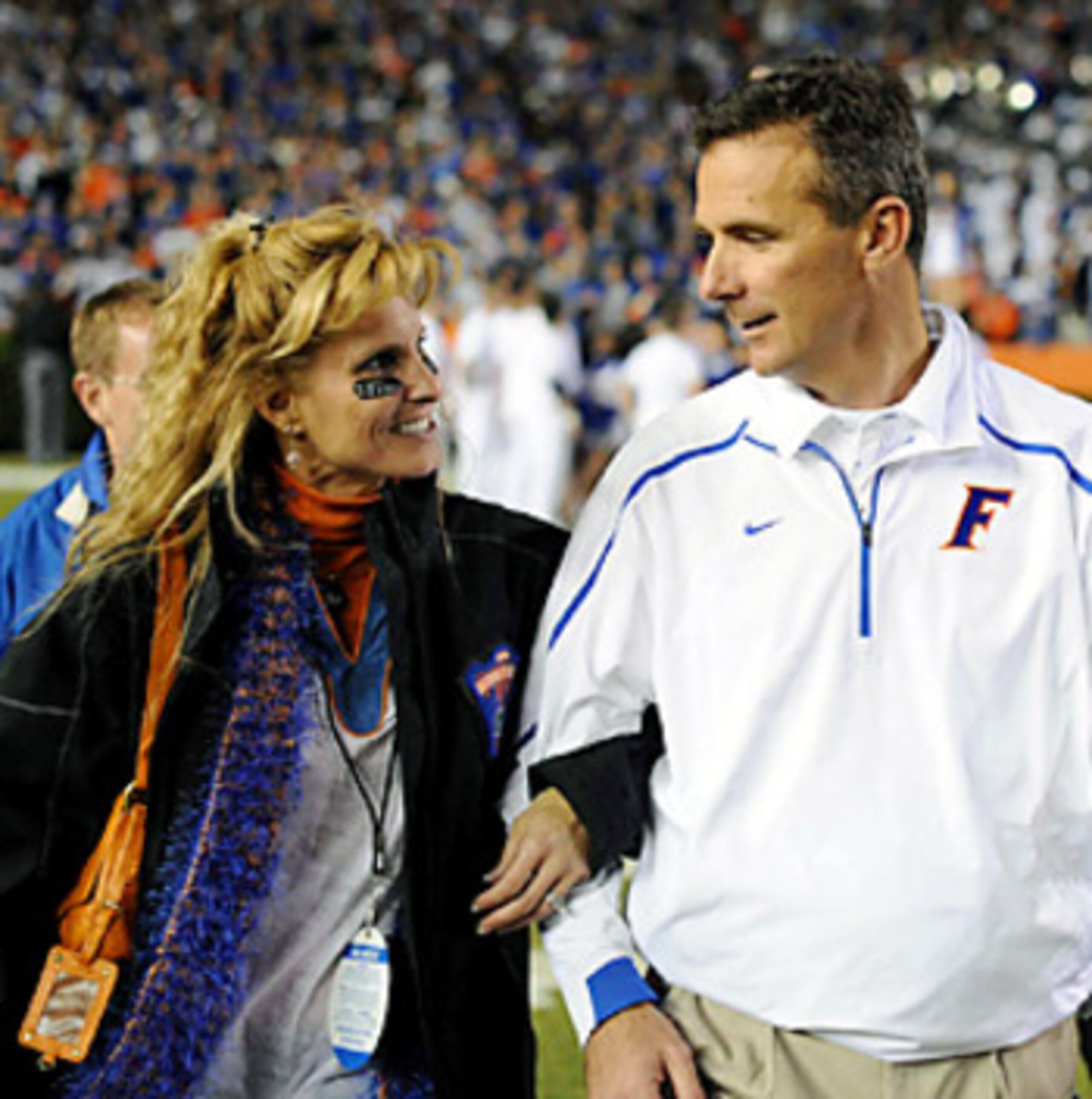 TAMPA, FL - JANUARY 1: Coach Urban Meyer of the Florida Gators hugs his wife, Shelley, after play against the Penn State Nittany Lions January 1, 2011 in the 25th Outback Bowl at Raymond James Stadium in Tampa, Florida. (Photo by Al Messerschmidt/Getty TAMPA, FL - JANUARY 1: Coach Urban Meyer of the Florida Gators hugs his wife, Shelley, after play against the Penn State Nittany Lions January 1, 2011 in the 25th Outback Bowl at Raymond James Stadium in Tampa, Florida. (Photo by Al Messerschmidt/Getty