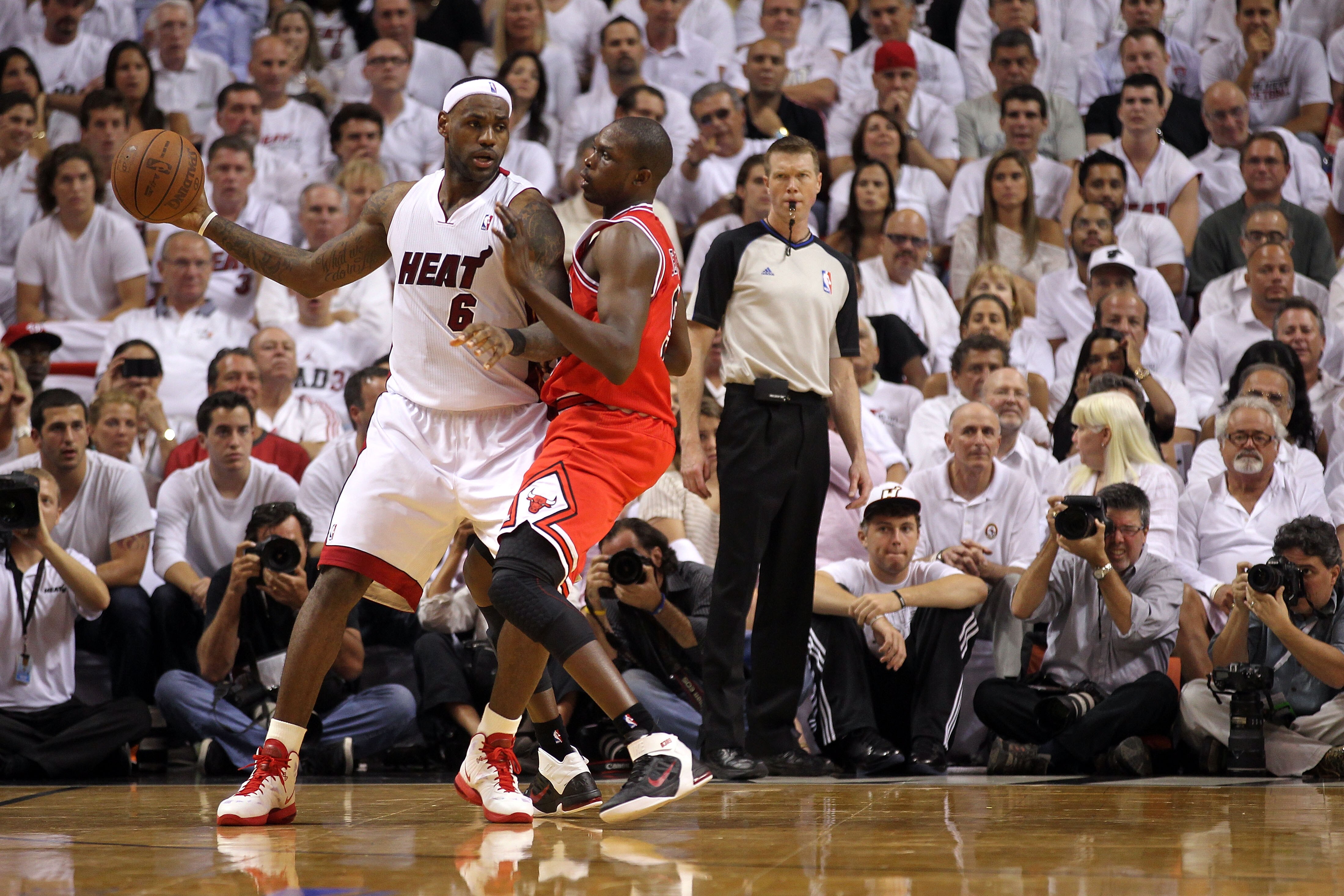 MIAMI, FL - MAY 24:  LeBron James #6 of the Miami Heat looks to pass against Luol Deng #9 of the Chicago Bulls in Game Four of the Eastern Conference Finals during the 2011 NBA Playoffs on May 24, 2011 at American Airlines Arena in Miami, Florida. The Hea