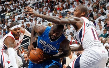 ATLANTA, GA - APRIL 22:  Jason Richardson #23 of the Orlando Magic drives between Josh Smith #5 and Jamal Crawford #11 of the Atlanta Hawks during Game Three of the Eastern Conference Quarterfinals in the 2011 NBA Playoffs at Philips Arena on April 22, 20