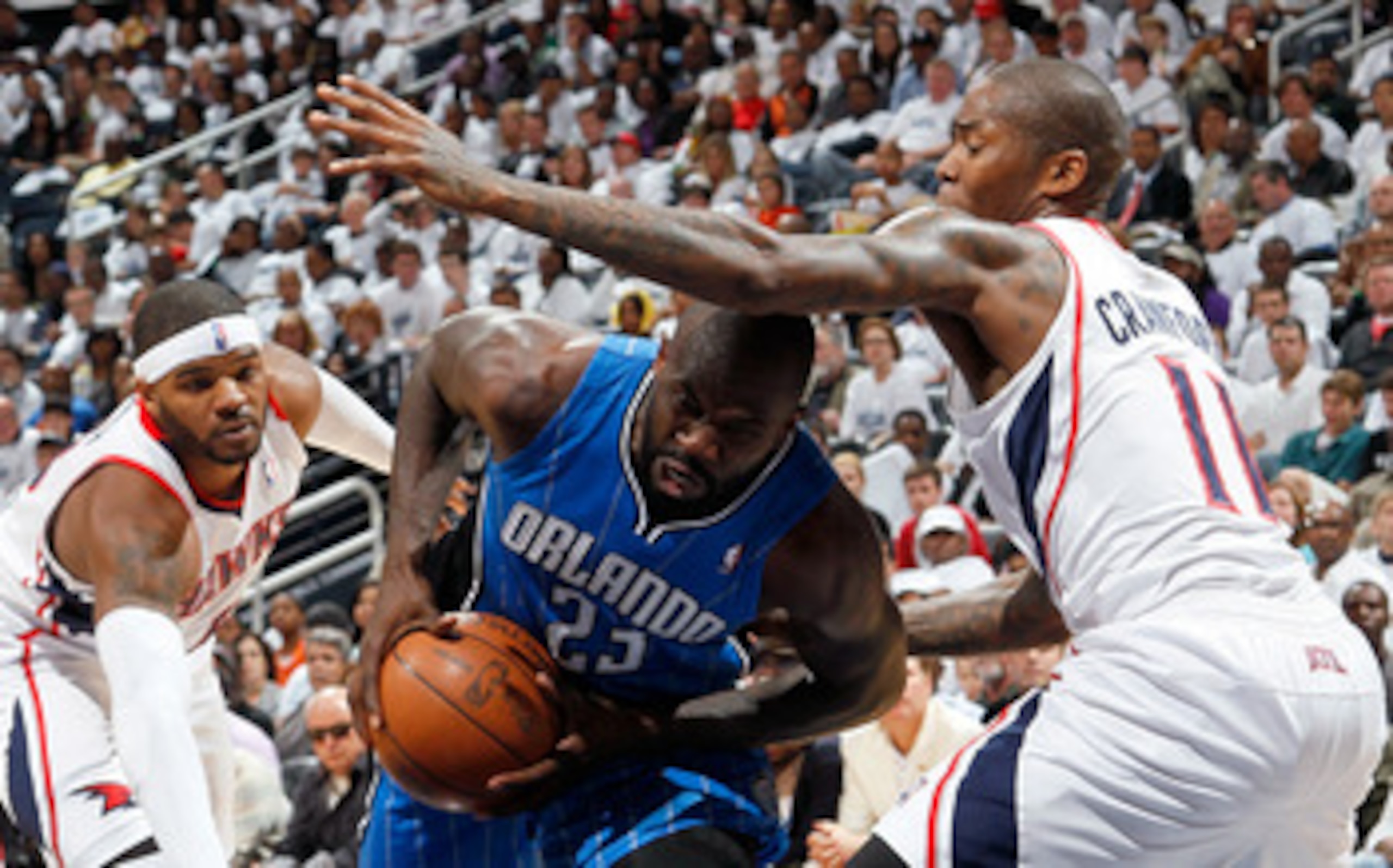 ATLANTA, GA - APRIL 22:  Jason Richardson #23 of the Orlando Magic drives between Josh Smith #5 and Jamal Crawford #11 of the Atlanta Hawks during Game Three of the Eastern Conference Quarterfinals in the 2011 NBA Playoffs at Philips Arena on April 22, 20