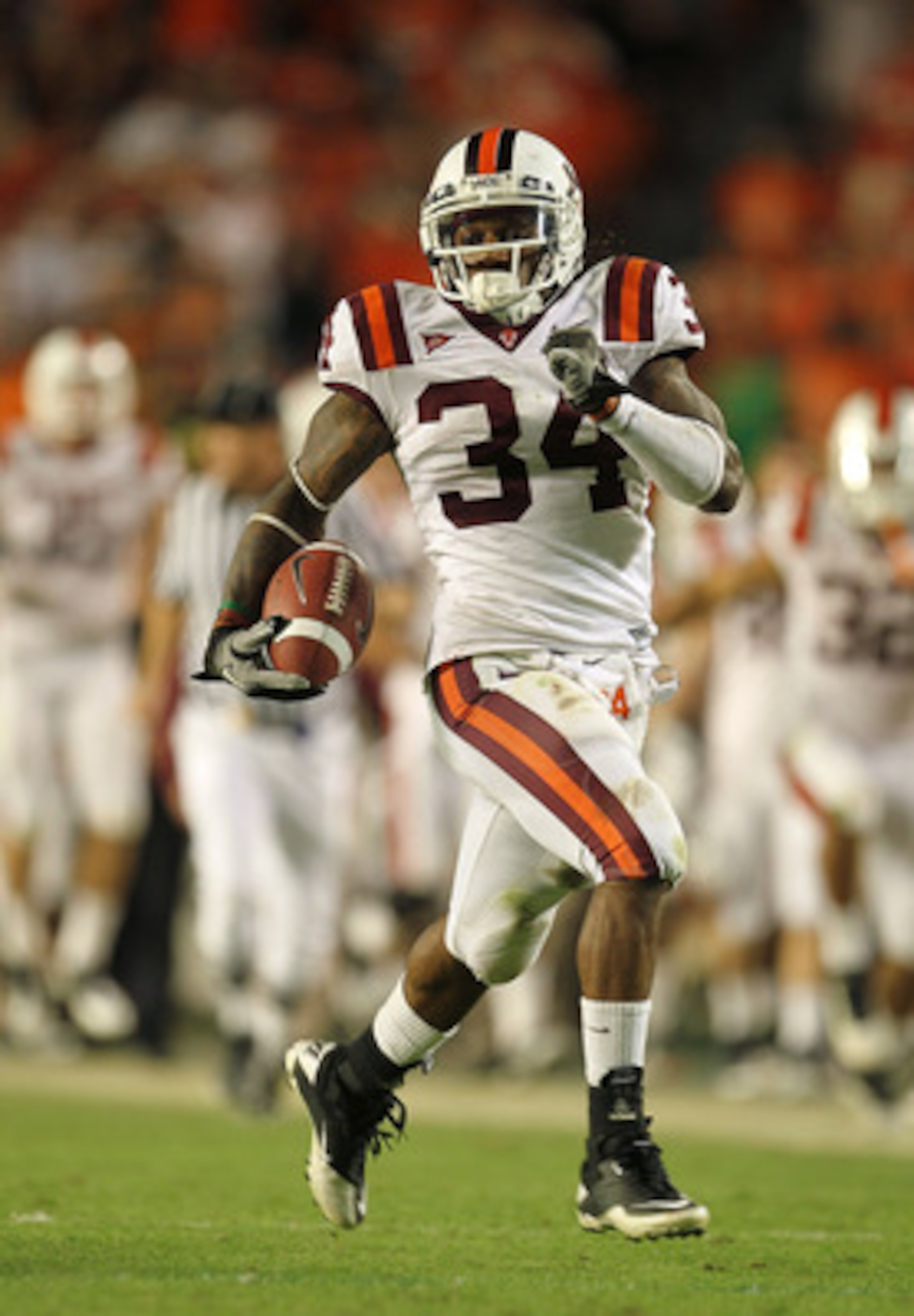 MIAMI - NOVEMBER 20:  Ryan Williams #34 of the Virginia Tech Hokies runs for a touchdown during a game against the Miami Hurricanes at Sun Life Stadium on November 20, 2010 in Miami, Florida.  (Photo by Mike Ehrmann/Getty Images)
