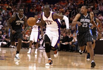 PHOENIX, AZ - MARCH 13:  Mickael Pietrus #12 of the Phoenix Suns handles the ball during the NBA game against the Orlando Magic at US Airways Center on March 13, 2011 in Phoenix, Arizona.  NOTE TO USER: User expressly acknowledges and agrees that, by down
