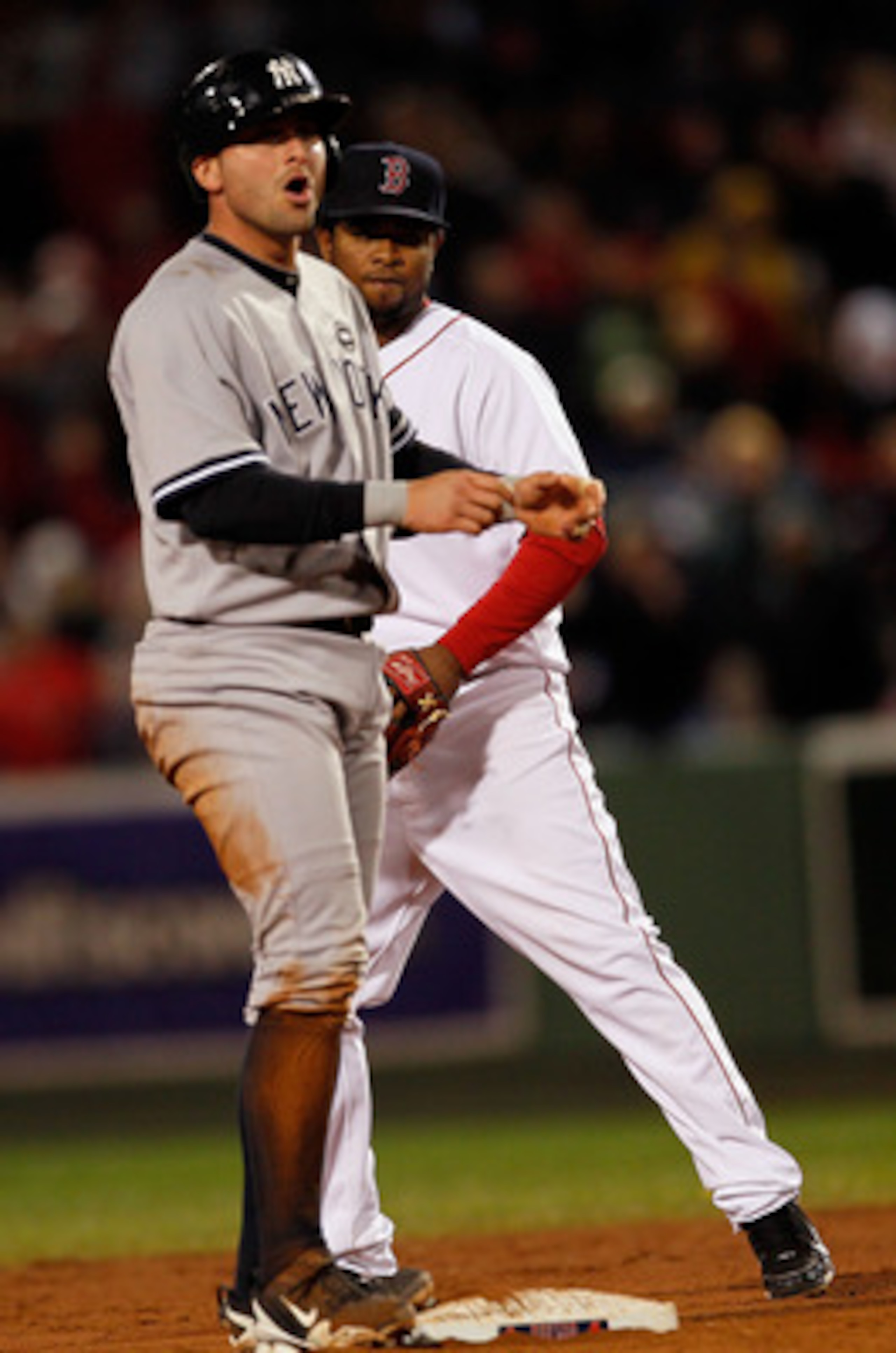 BOSTON - OCTOBER 2: Francisco Cervelli #29 of the New York Yankees reacts after he doubles to knock in a run as Eric Patterson #3 of the Boston Red Sox looks on  Fenway Park, October 2, 2010, in Boston, Massachusetts. (Photo by Jim Rogash/Getty Images)