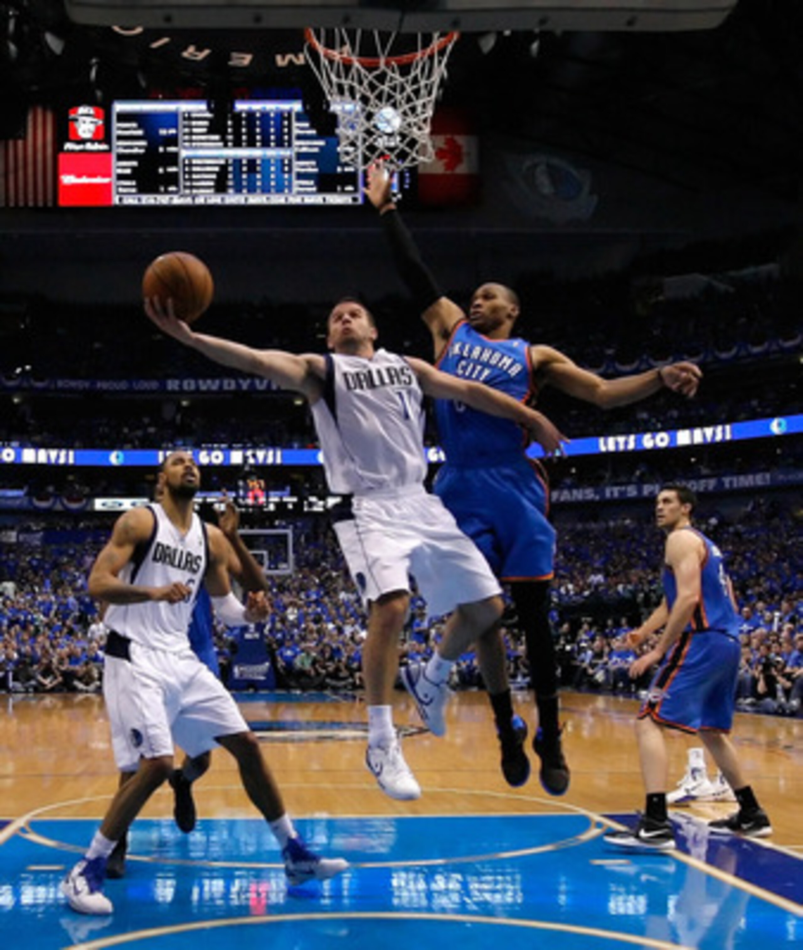 DALLAS, TX - MAY 25:  Jose Juan Barea #11 of the Dallas Mavericks goes up for a shot against Russell Westbrook #0 of the Oklahoma City Thunder in the first half in Game Five of the Western Conference Finals during the 2011 NBA Playoffs at American Airline