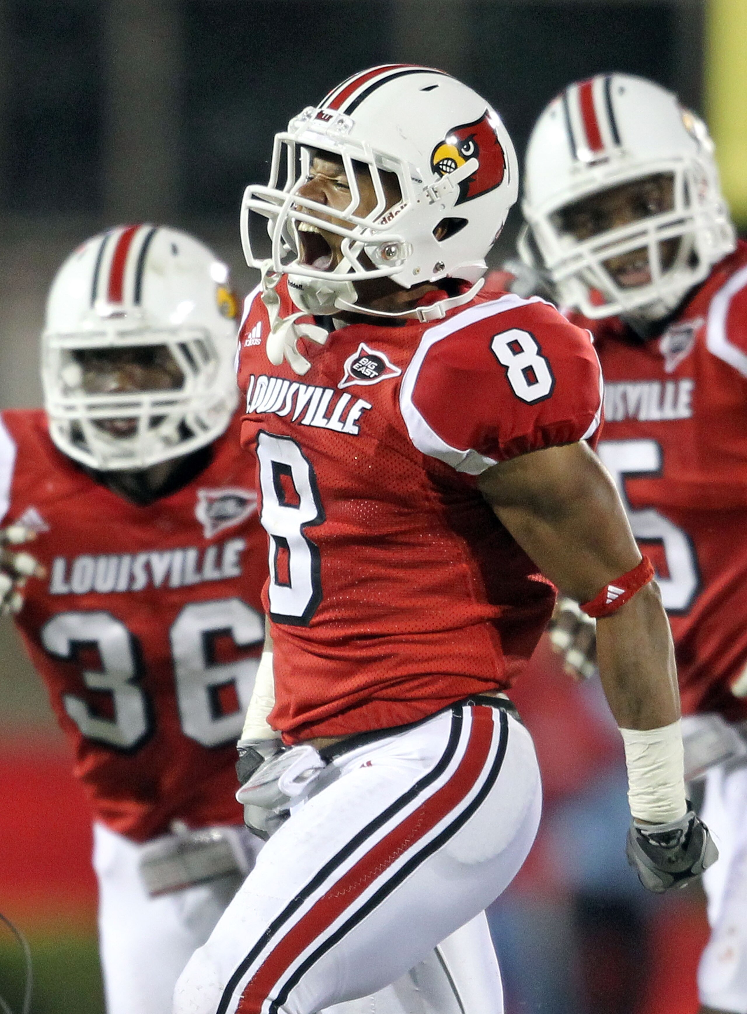 LOUISVILLE, KY - OCTOBER 15:  Darius Ashley #8 of  the Louisville Cardinals  celebrates after intercepting a pass during the Big East Conference game against the Cincinnati Bearcats at Papa John's Cardinal Stadium on October 15, 2010 in Louisville, Kentuc
