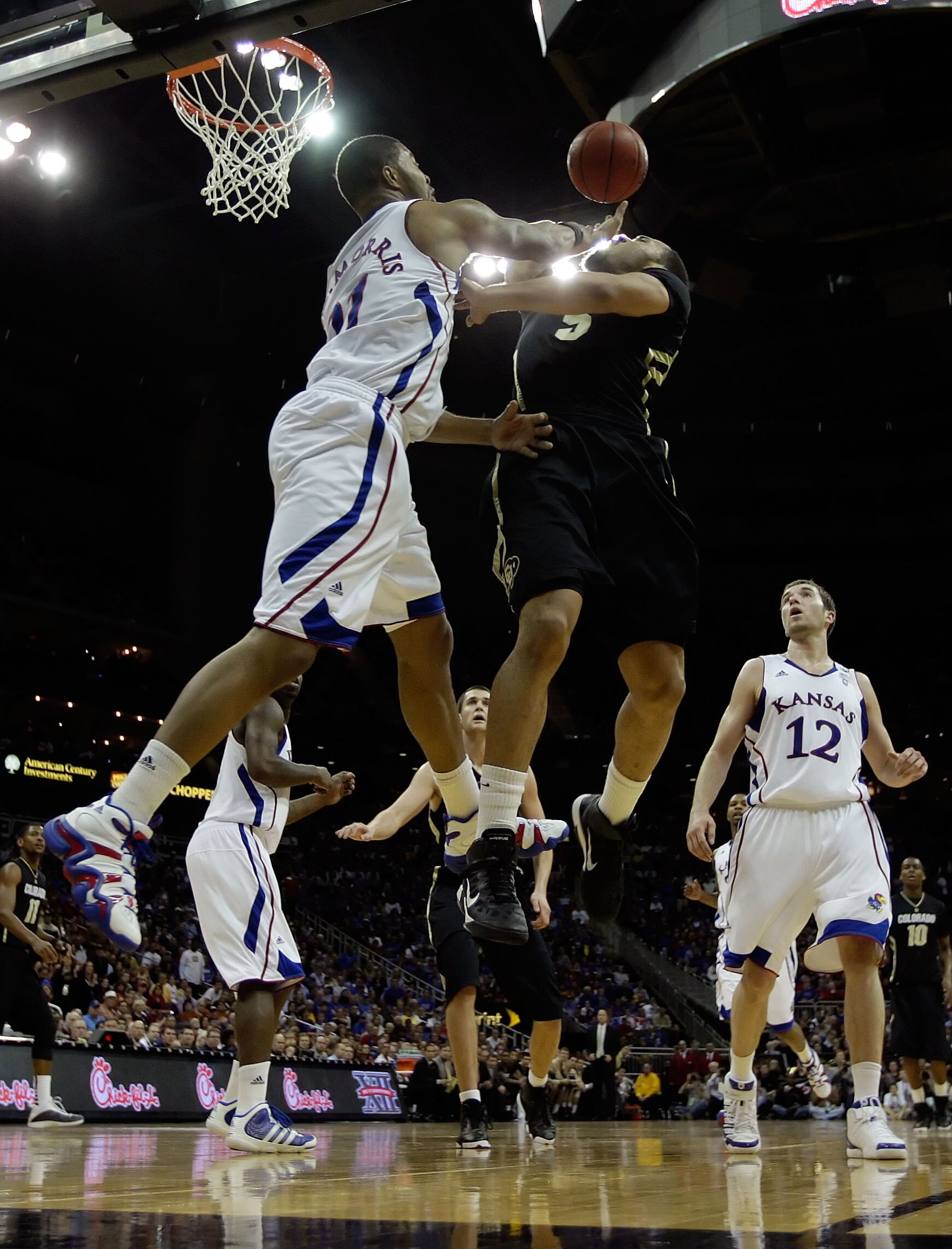 KANSAS CITY, MO - MARCH 11:  Marcus Relphorde #5 of the Colorado Buffaloes goes up for a shot against Markieff Morris #21 of the Kansas Jayhawks during their semifinal game in the 2011 Phillips 66 Big 12 Men's Basketball Tournament at Sprint Center on Mar
