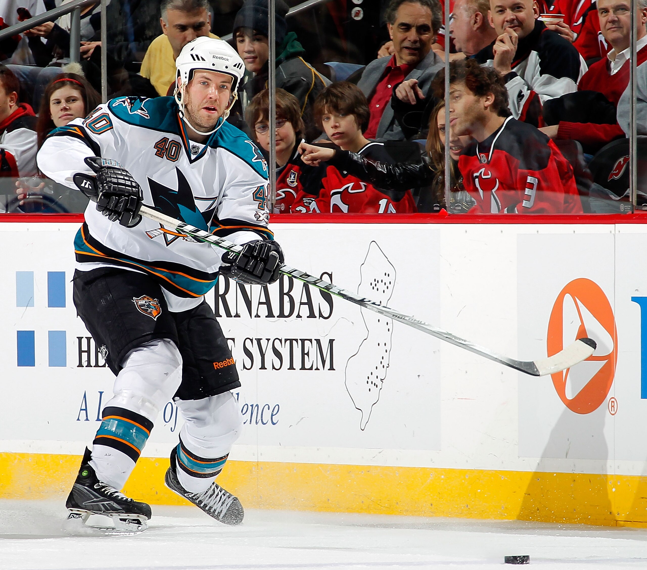 NEWARK, NJ - FEBRUARY 11: Kent Huskins #40 of the San Jose Sharks skates during an NHL hockey game against the New Jersey Devils on February 11, 2011 at the Prudential Center in Newark, New Jersey. (Photo by Paul Bereswill/Getty Images)