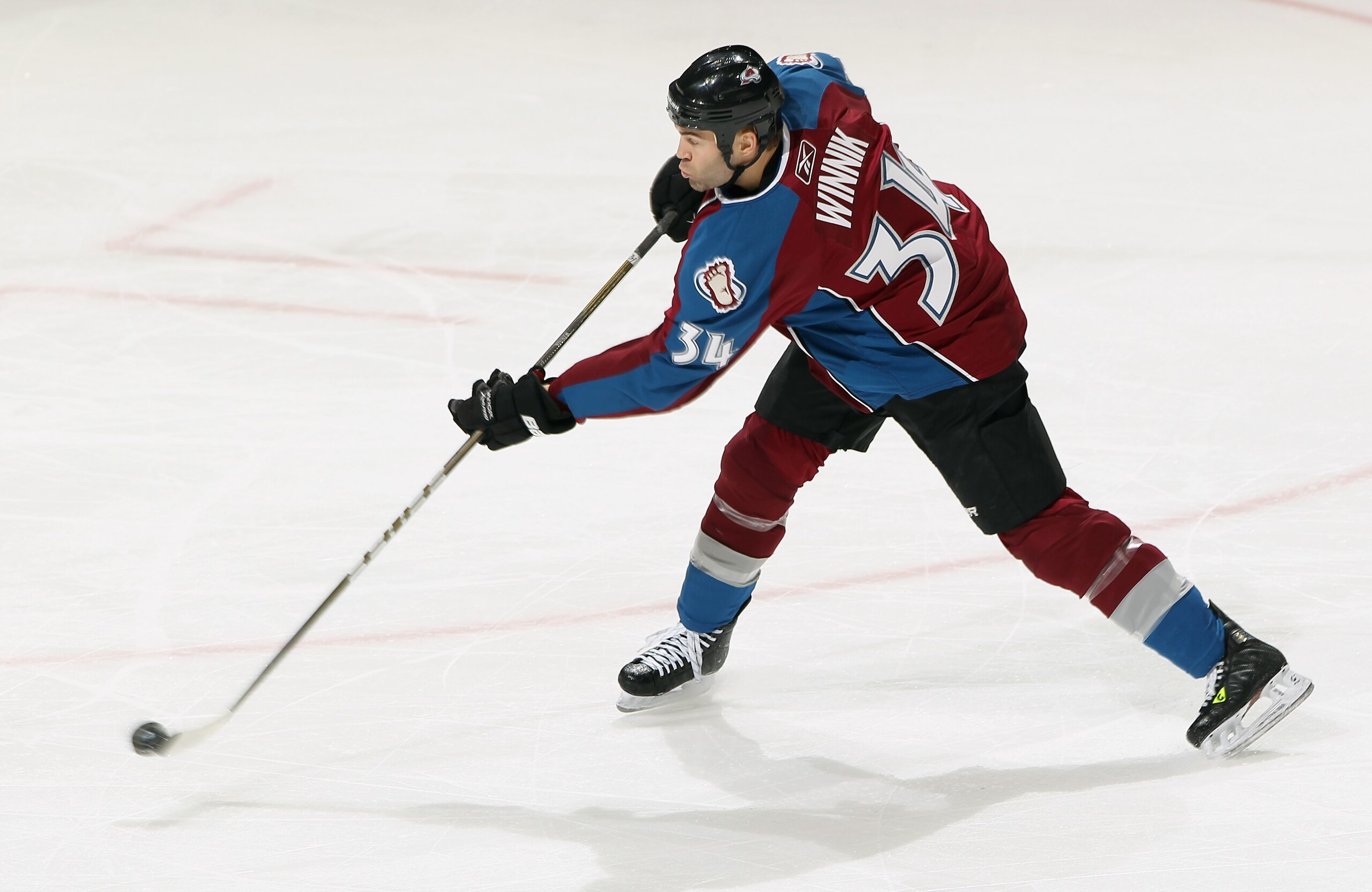 DENVER, CO - MARCH 31:  Daniel Winnik #34 of the Colorado Avalanche shoots the puck against the Nashville Predators at the Pepsi Center on March 31, 2011 in Denver, Colorado. The Nashville Predators defeated the Colorado Avalanche 3-2.  (Photo by Doug Pen