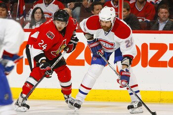 OTTAWA, CANADA - APRIL 07:  Stephane Da Costa #24 of the Ottawa Senators lines up for a faceoff across from Paul Mara #22 of the Montreal Canadiens in a game at Scotiabank Place on April 7, 2011 in Ottawa, Canada.  (Photo by Phillip MacCallum/Getty Images