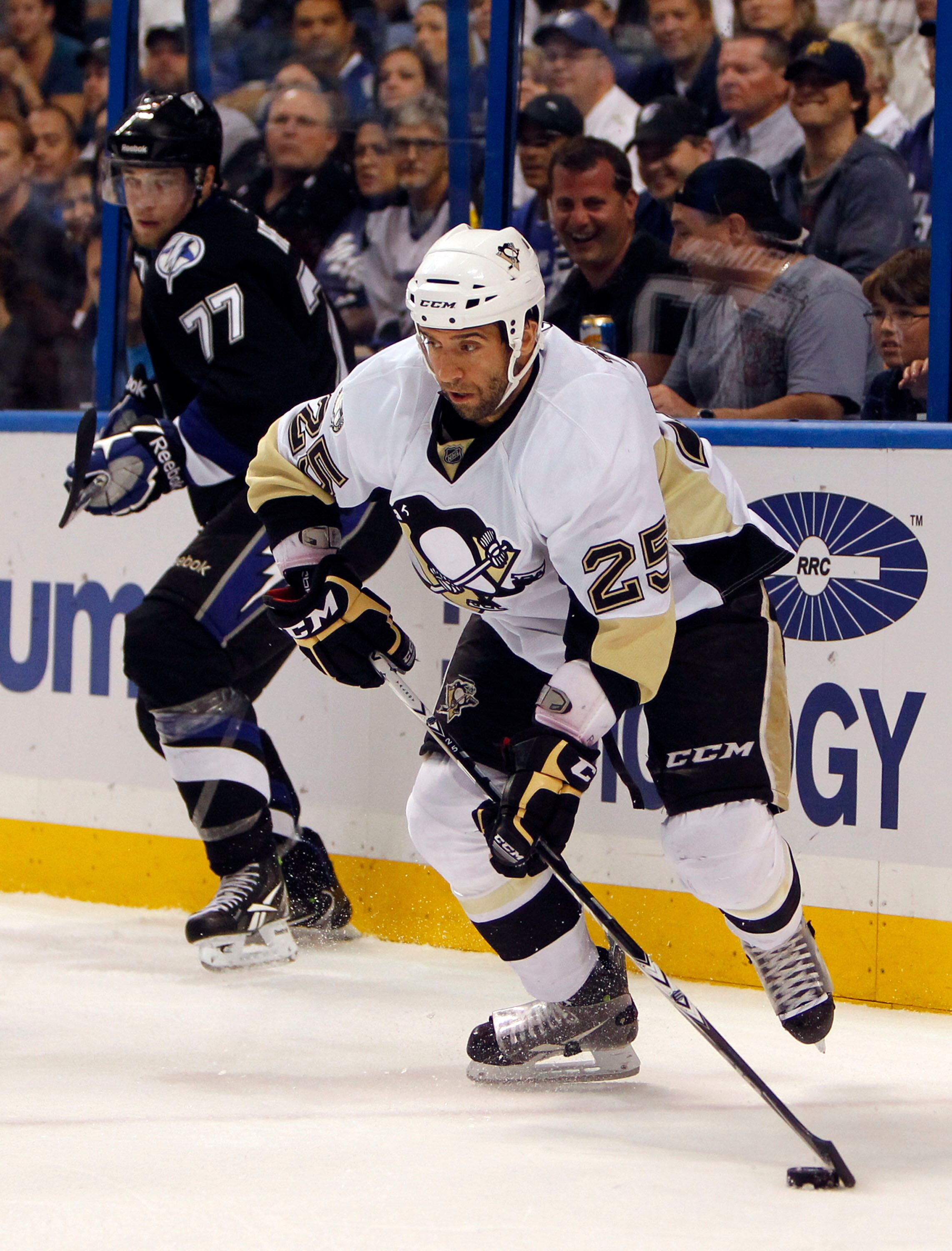 TAMPA, FL - APRIL 20: Maxime Talbot #25 of the Pittsburgh Penguins skates with the puck against the Tampa Bay Lightning in Game Four of the Eastern Conference Quarterfinals during the 2011 NHL Stanley Cup Playoffs at the St. Pete Times Forum on April 20,