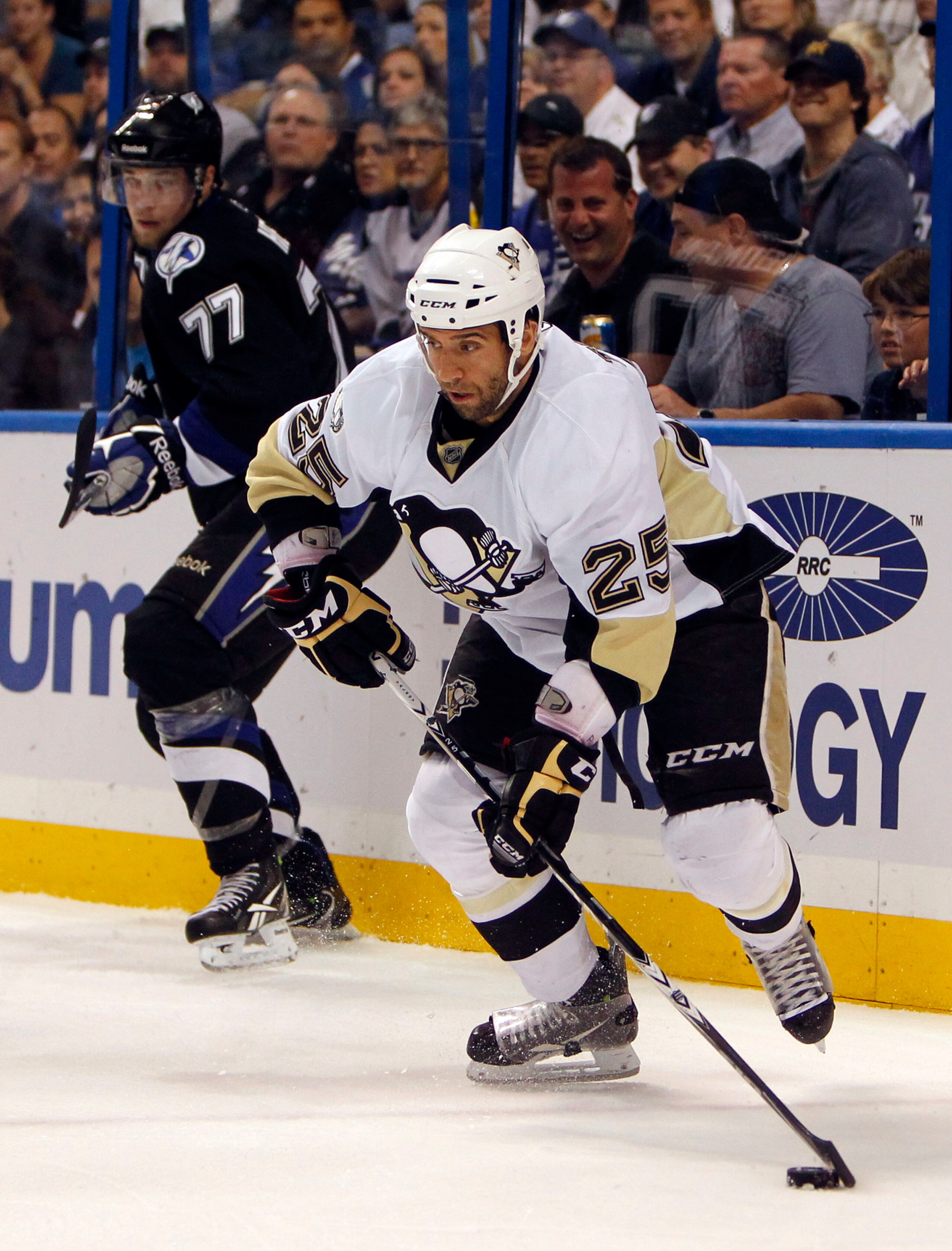 TAMPA, FL - APRIL 20: Maxime Talbot #25 of the Pittsburgh Penguins skates with the puck against the Tampa Bay Lightning in Game Four of the Eastern Conference Quarterfinals during the 2011 NHL Stanley Cup Playoffs at the St. Pete Times Forum on April 20,