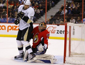 OTTAWA, CANADA - MARCH 15:  Michael Rupp #17 of the Pittsburgh Penguins interferes with Craig Anderson #41 of the Ottawa Senators while trying to provide a screen during a game at Scotiabank Place on March 15, 2011 in Ottawa, Canada.  (Photo by Phillip Ma