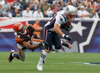 FOXBORO, MA - SEPTEMBER 12:  Wes Welker #83 of the New England Patriots gains yardage despite the defense of Leon Hall #29 of the Cincinnati Bengals during during the NFL season opener at Gillette Stadium on September 12, 2010 in Foxboro, Massachusetts. (