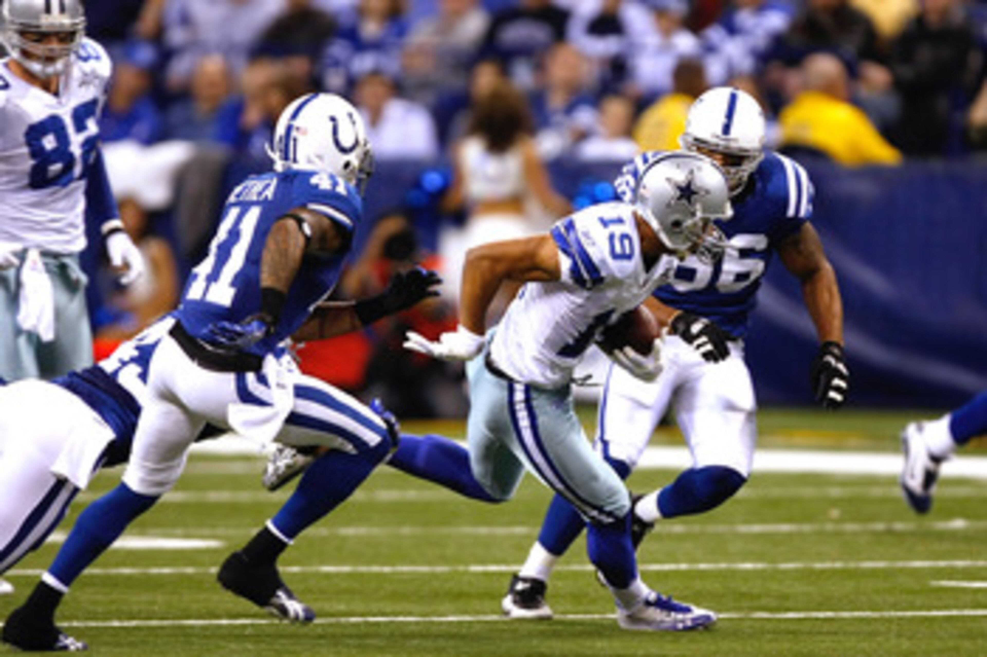 INDIANAPOLIS, IN - DECEMBER 05: Miles Austin #19 of the Dallas Cowboys runs against the Indianapolis Colts at Lucas Oil Stadium on December 5, 2010 in Indianapolis, Indiana. The Cowboys defeated the Colts 38-35 in overtime. (Photo by Scott Boehm/Getty Ima