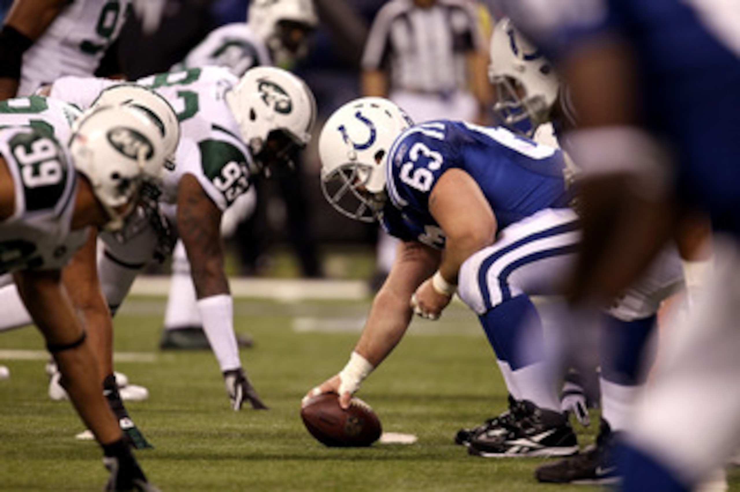 INDIANAPOLIS, IN - JANUARY 08:  Center Jeff Saturday #63 of the Indianapolis Colts readies to snap the ball against the New York Jets during their 2011 AFC wild card playoff game at Lucas Oil Stadium on January 8, 2011 in Indianapolis, Indiana. The Jets w