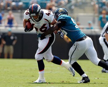 JACKSONVILLE, FL - SEPTEMBER 12:  Terrance Knighton #96 of the Jacksonville Jaguars attempts to tackle Spencer Larsen #46 of the Denver Broncos during the NFL season opener game at EverBank Field on September 12, 2010 in Jacksonville, Florida.  (Photo by 