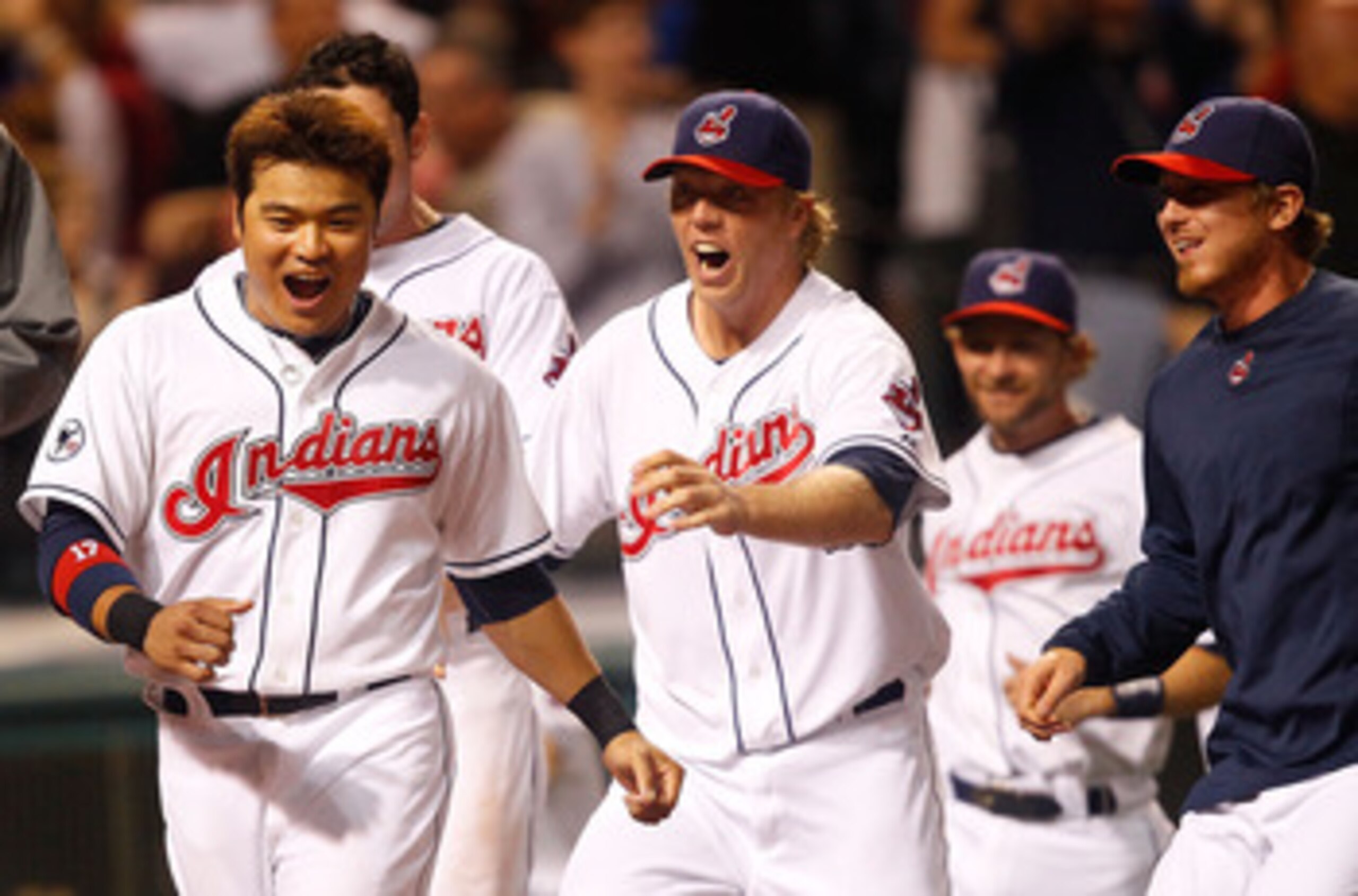 CLEVELAND - MAY 13:  Shin-Soo Choo #17 of the Cleveland Indians and members of his team celebrate following the walk-off two run home run by Travis Hafner #48 in the 9th inning against the Seattle Mariners during the game on May 13, 2011 at Progressive Fi