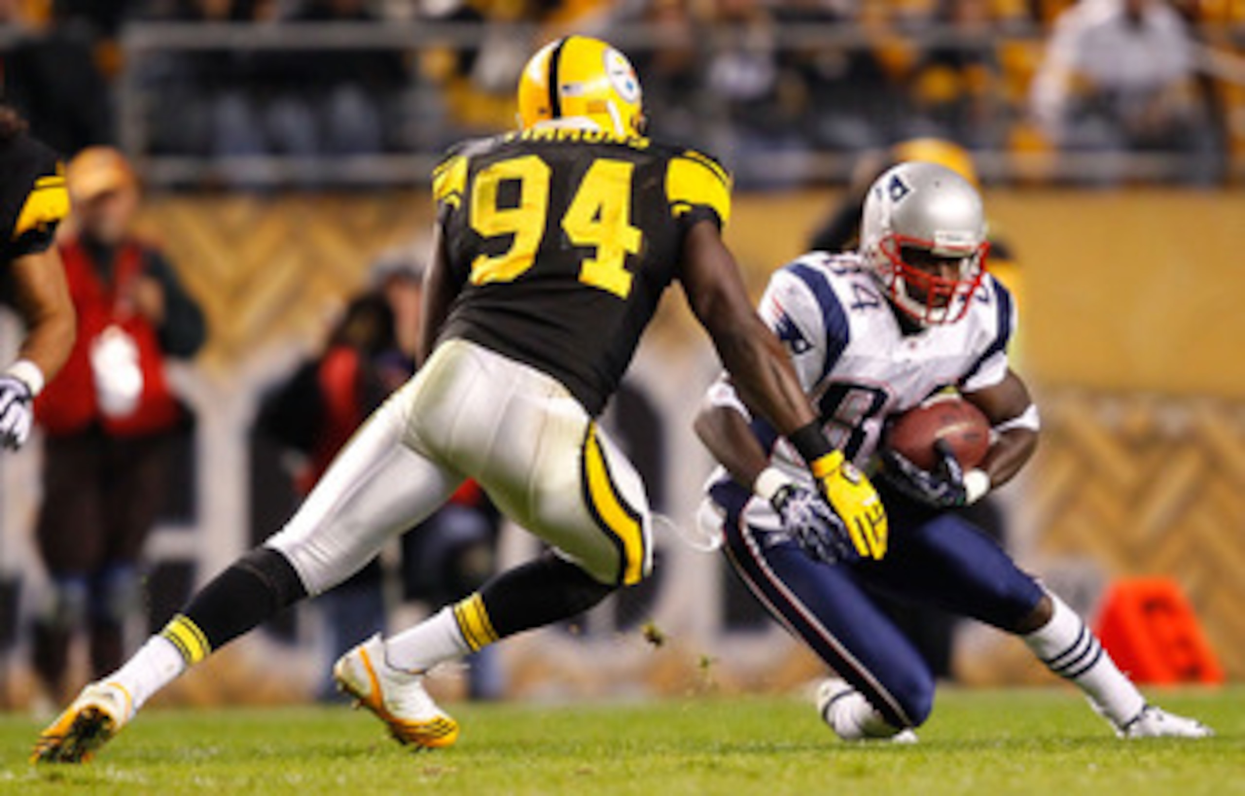 PITTSBURGH, PA - NOVEMBER 14:  Deion Branch #84 of the New England Patriots attempts to run by Lawrence Timmons #94 of the Pittsburgh Steelers during the game on November 14, 2010 at Heinz Field in Pittsburgh, Pennsylvania.  (Photo by Jared Wickerham/Gett