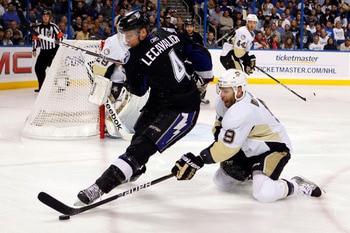 TAMPA, FL - APRIL 25: Vincent Lecavalier #4 of the Tampa Bay Lightning tangles with Pascal Dupuis #9 of the Pittsburgh Penguins in Game Six of the Eastern Conference Quarterfinals during the 2011 NHL Stanley Cup Playoffs at the St. Pete Times Forum on Apr